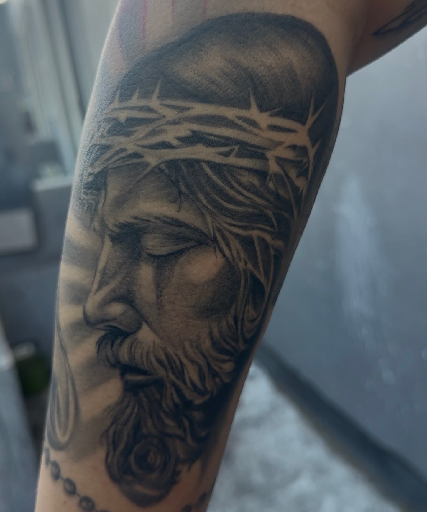 Jesus Christ realism tattoo on the forearm by H e I D I