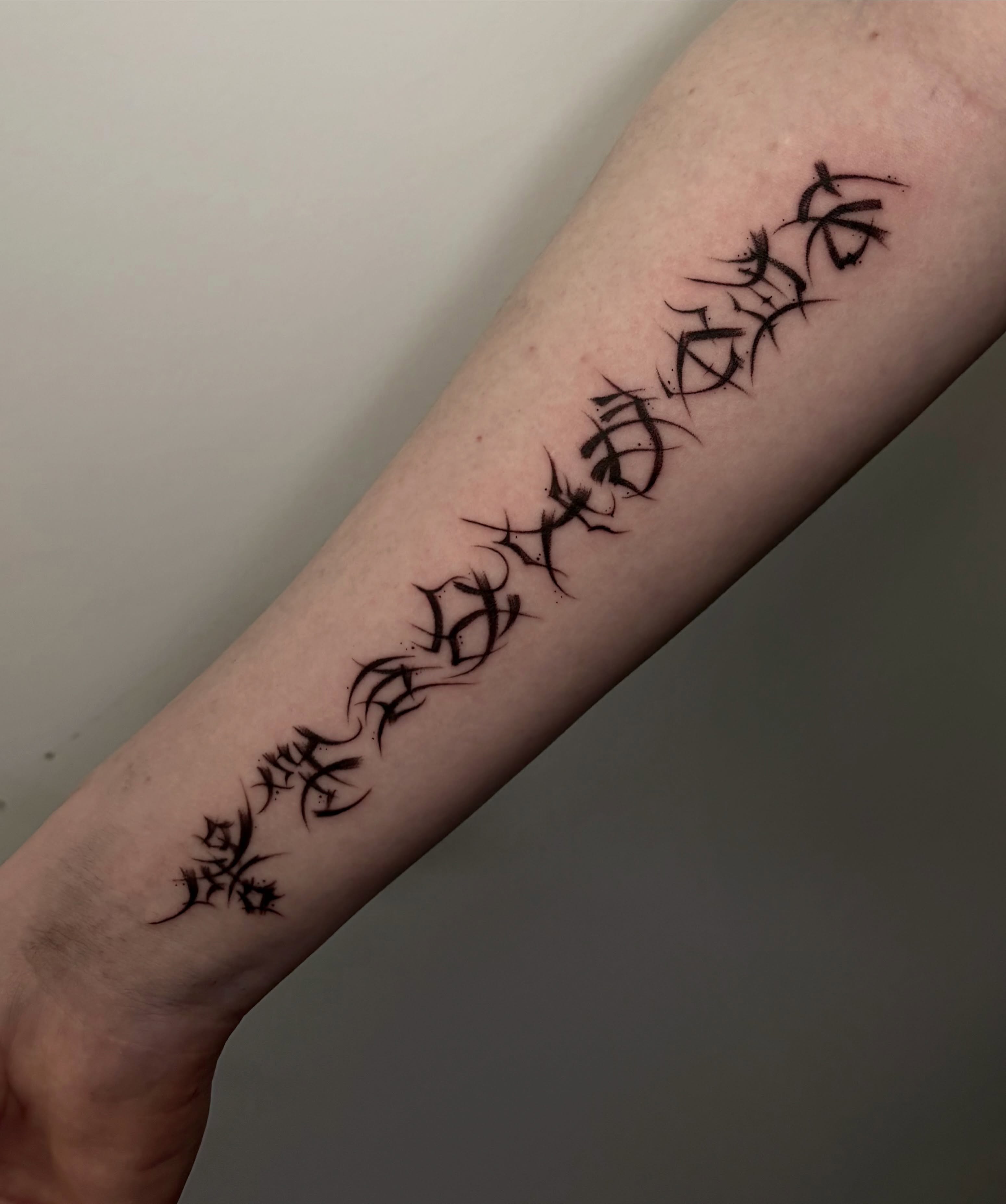 Kanji characters tribal tattoo on the forearm by ˖.𖥔 ݁˖anna hoffman˖ ⊹ ࣪ ˖, Salt Lake City, Utah