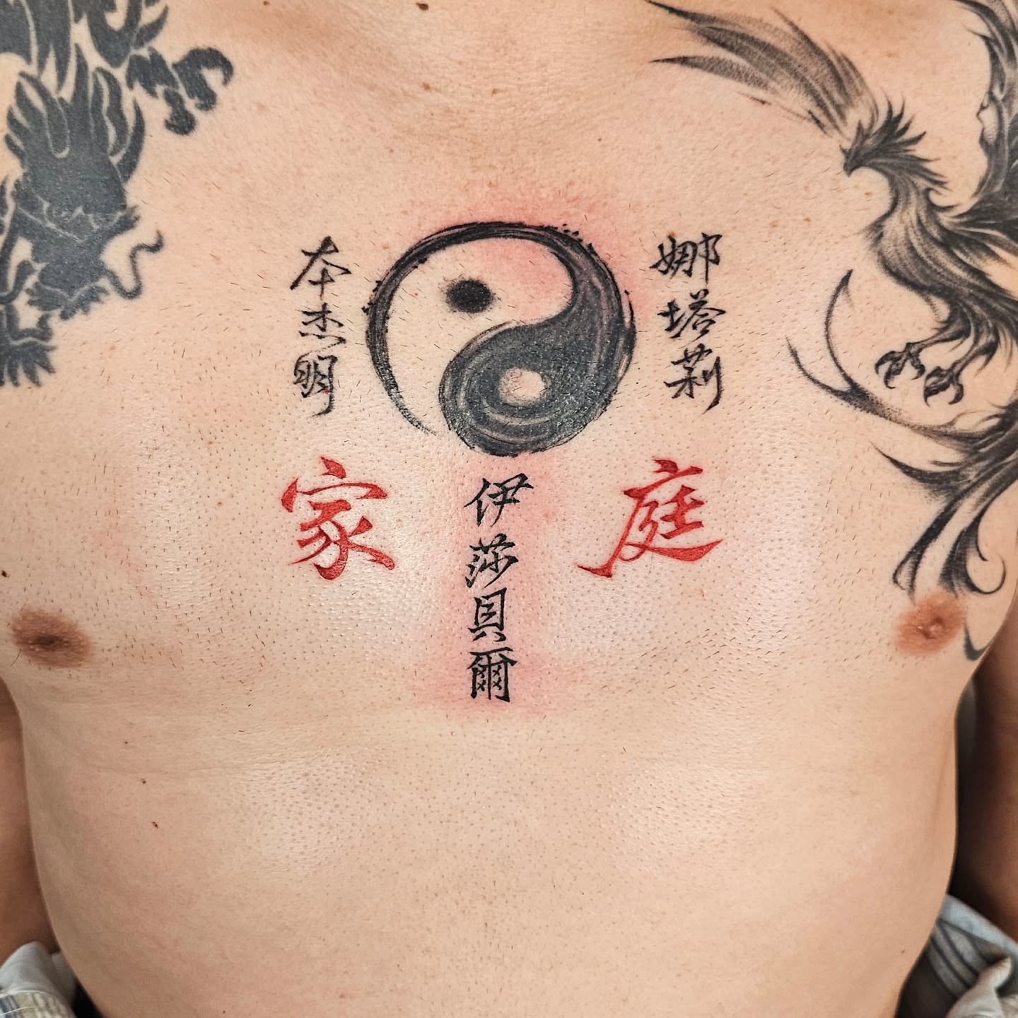Yin-yang symbol dotwork tattoo on the chest by Lili Gu