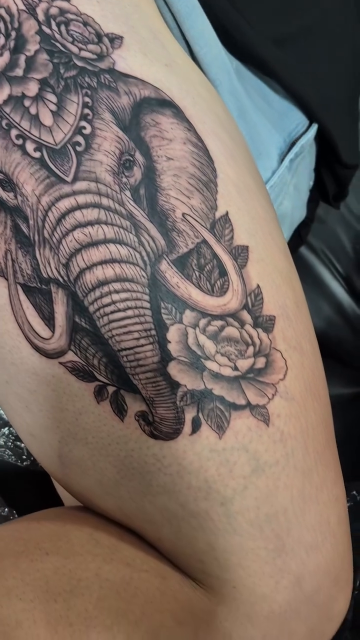 Elephant head with roses realism tattoo by Chris TL Jones