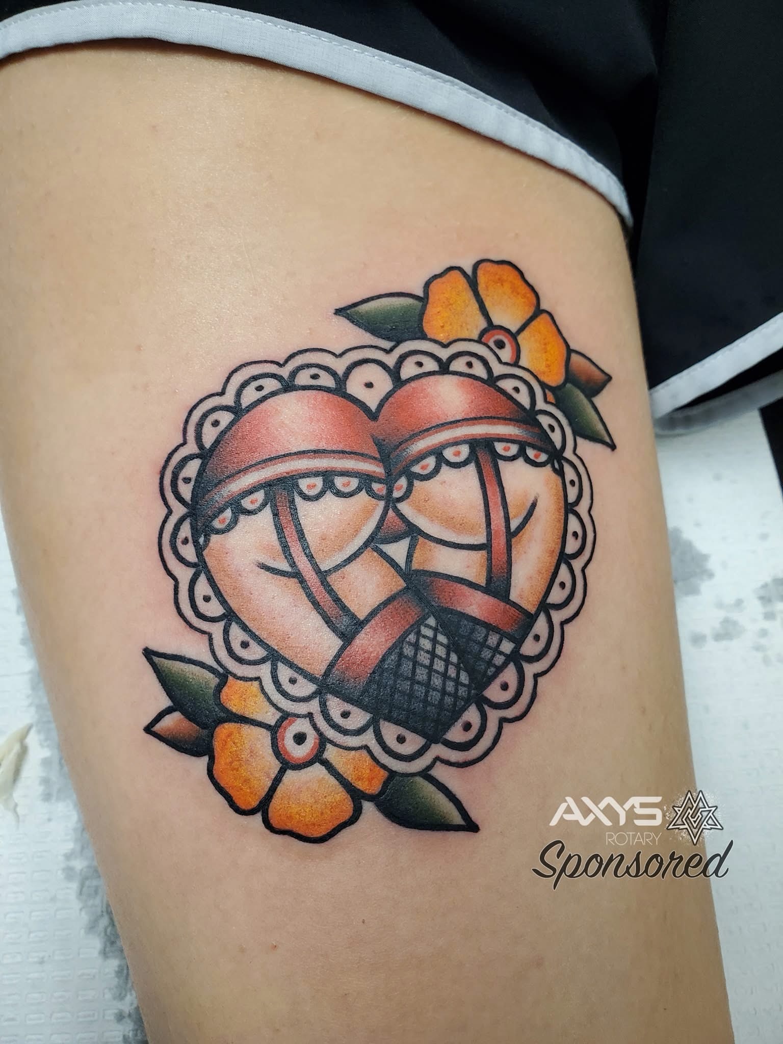 Basketball hearts American traditional tattoo on the thigh by Cameron Mills - Tattoo artist