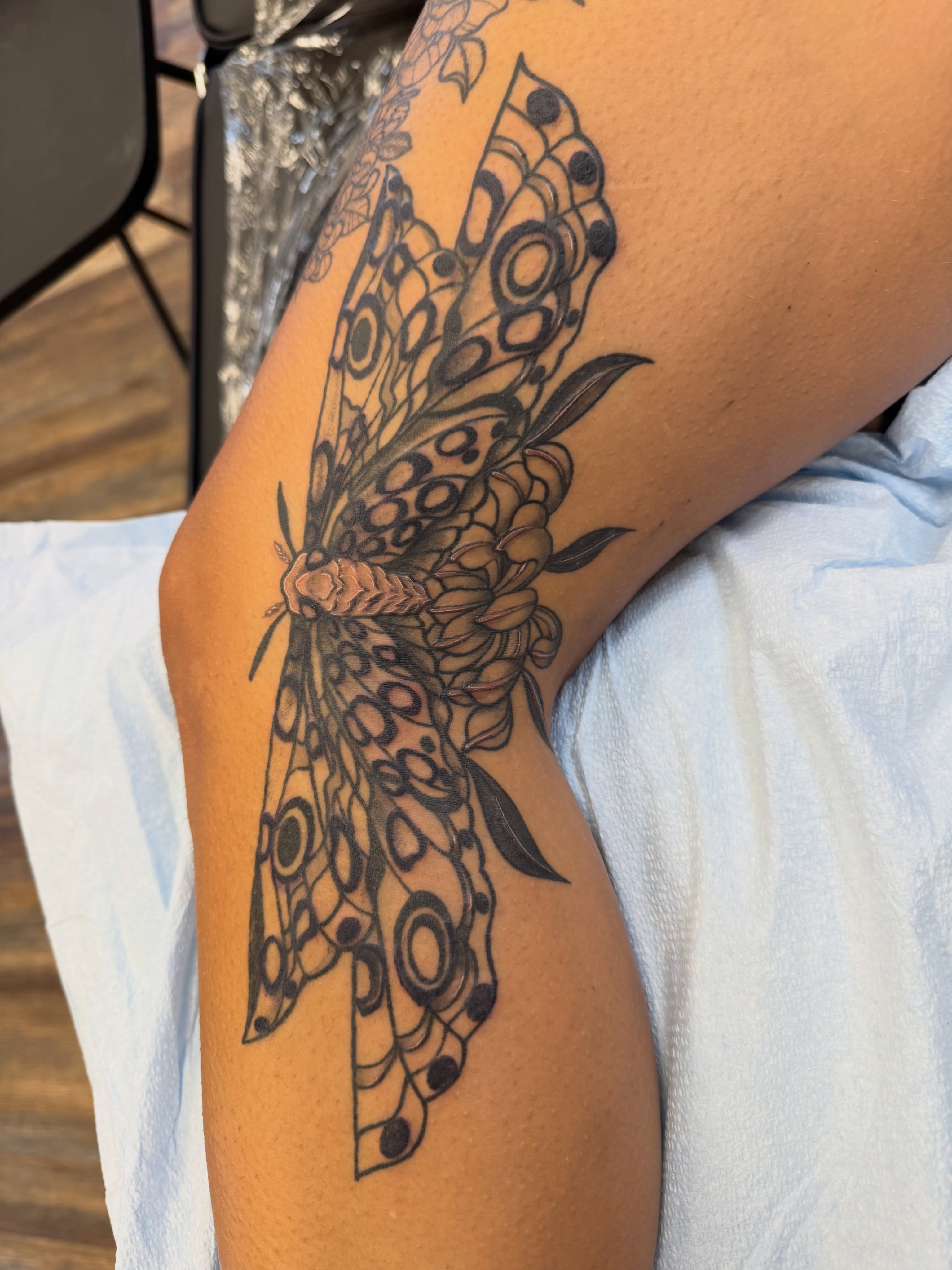 Butterfly black and grey tattoo on the forearm by Erin Moore
