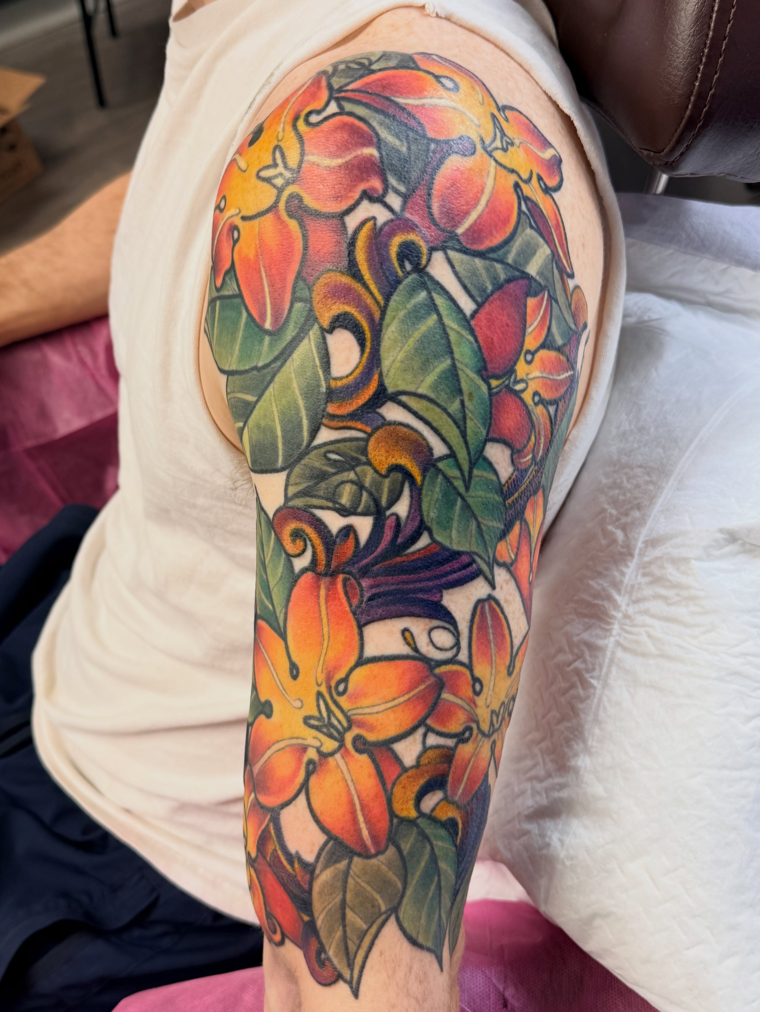 Lilies and leaves new school tattoo on the forearm by Kimberly Parton- Chapel Hill Tattooer, Chapel Hill, North Carolina