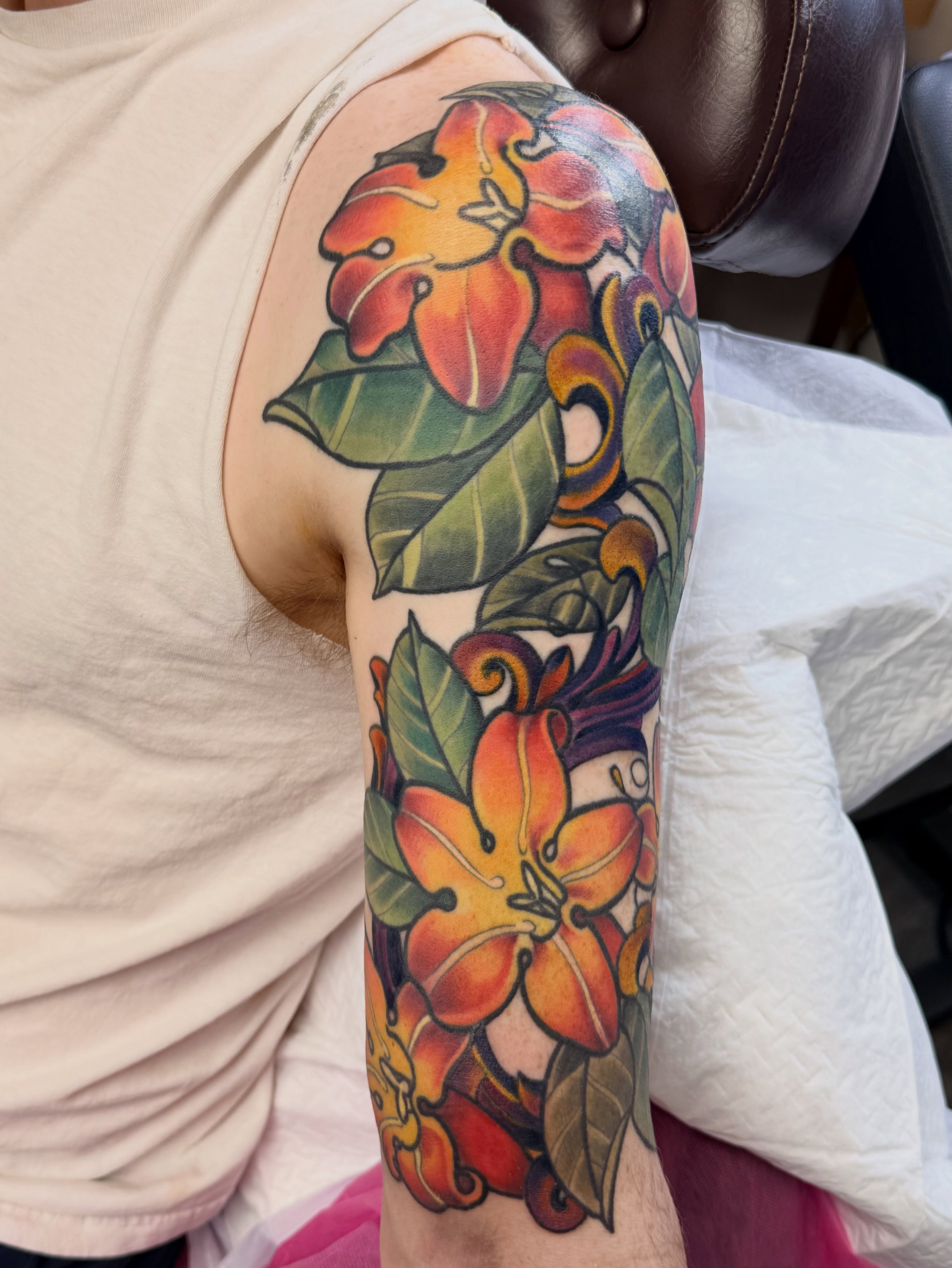 Lilies and leaves American traditional tattoo on the forearm by Kimberly Parton- Chapel Hill Tattooer, Chapel Hill, North Carolina