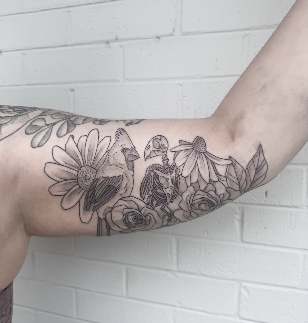 Bird and flowers realism tattoo on the forearm by Audrey Kacel, Holland, Michigan