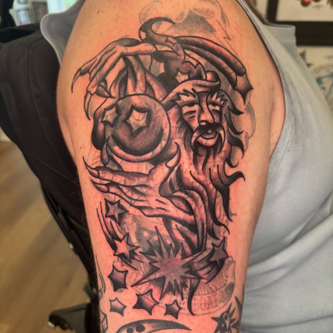 God-like figure black and grey tattoo on the shoulder by rachael