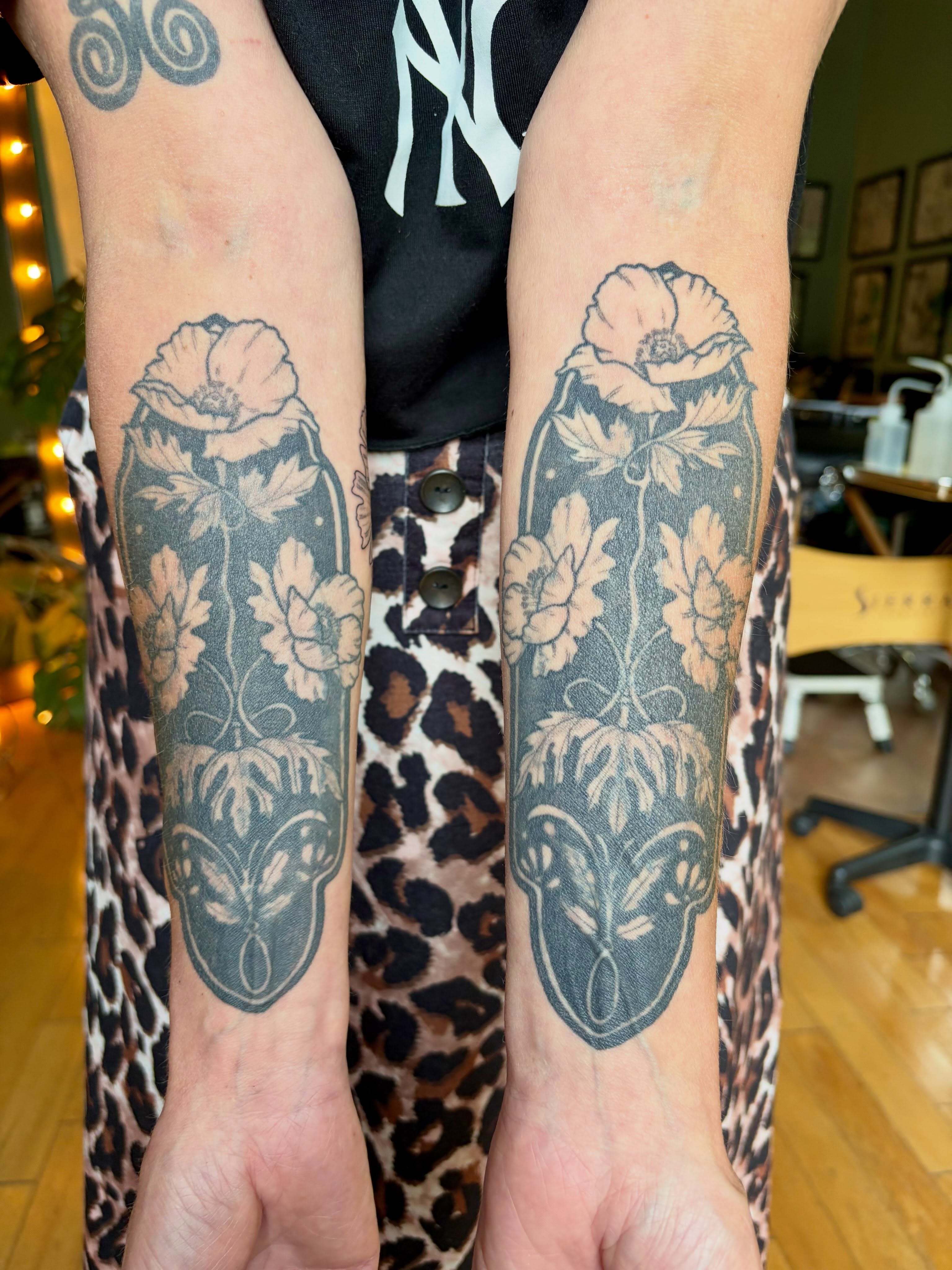 Poppy flowers black and grey tattoo on the forearm by Sarah Roach