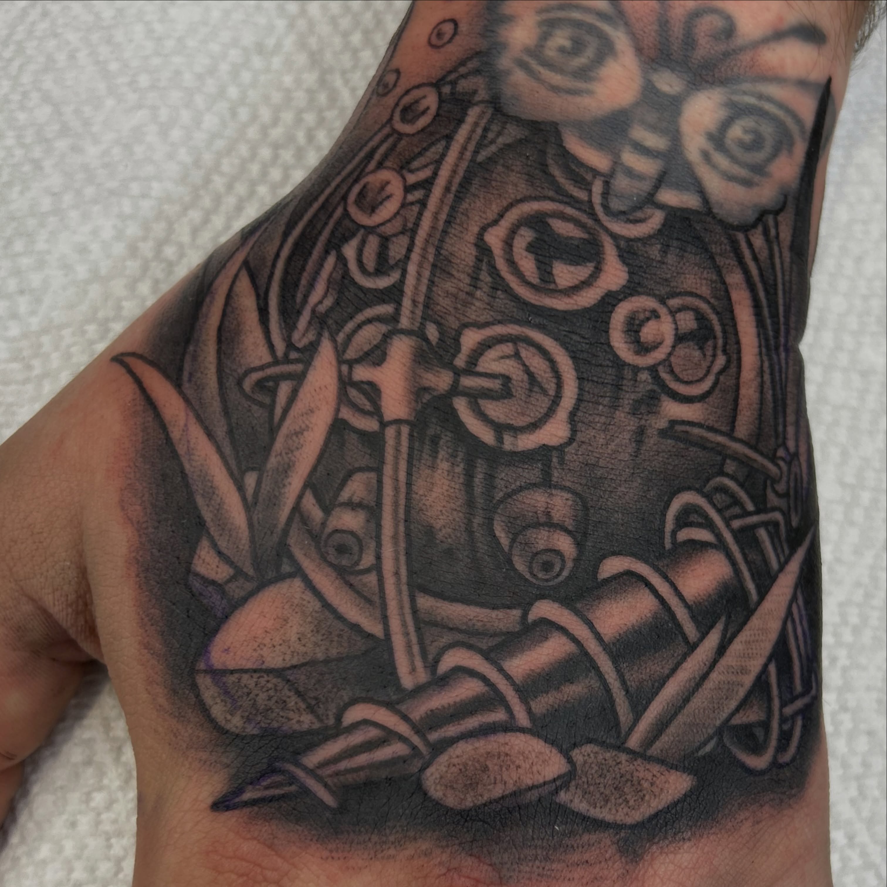 Mechanical gears and screws geometric tattoo on the forearm by Alex Byrne