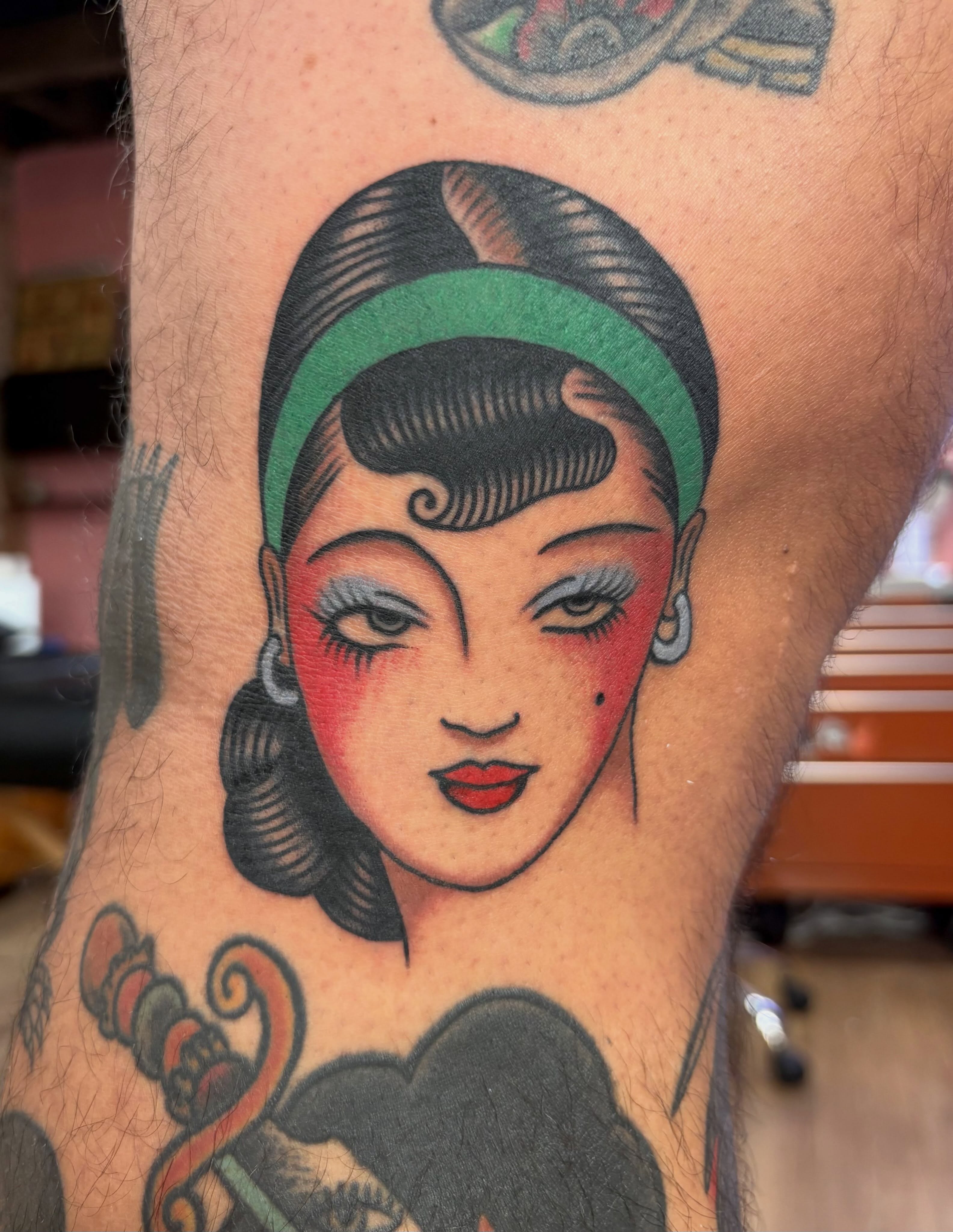 Flapper girl portrait American traditional tattoo on the forearm by Izzy