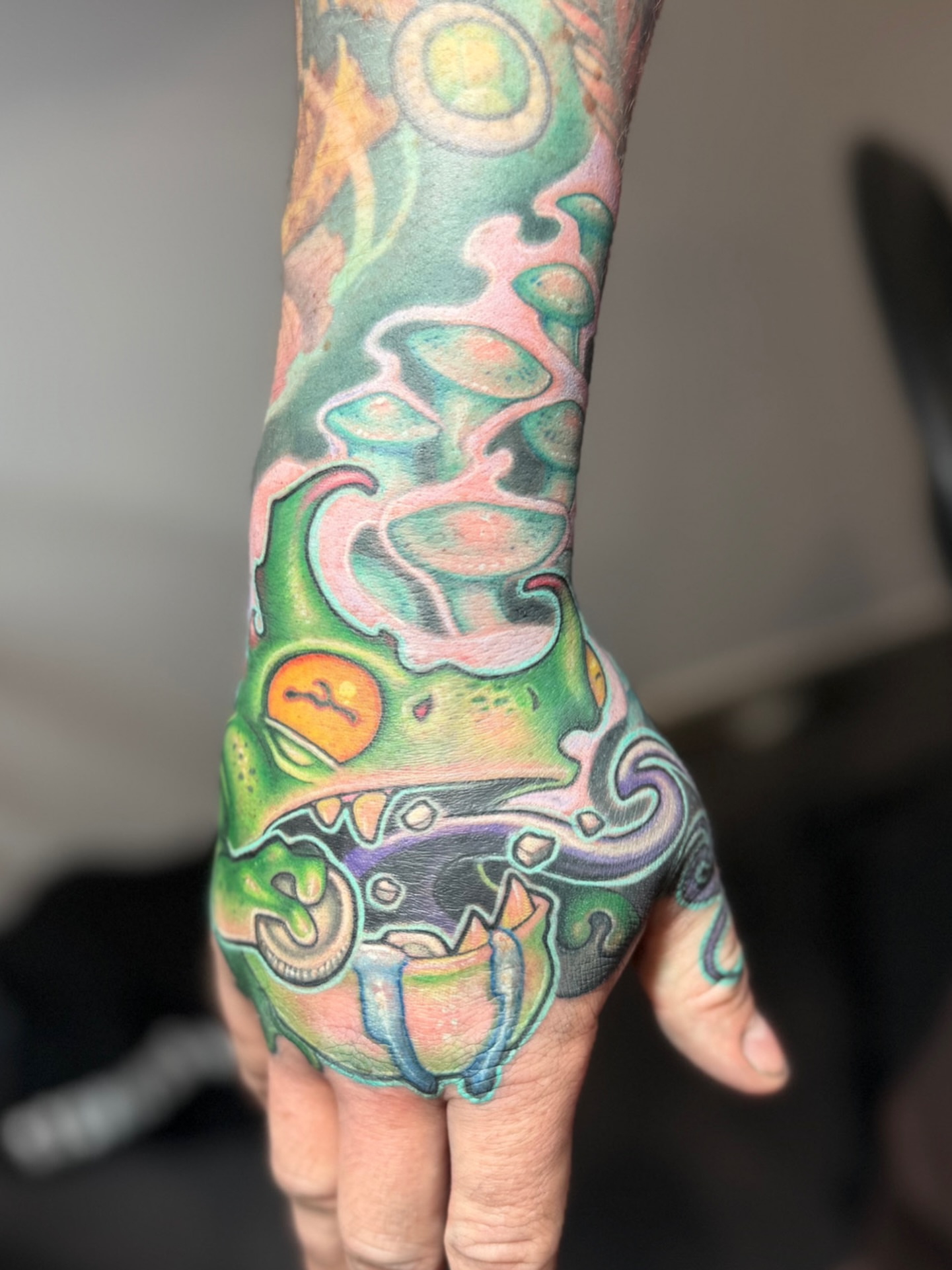 Abstract alien new school tattoo on the hand by Jessica Brown