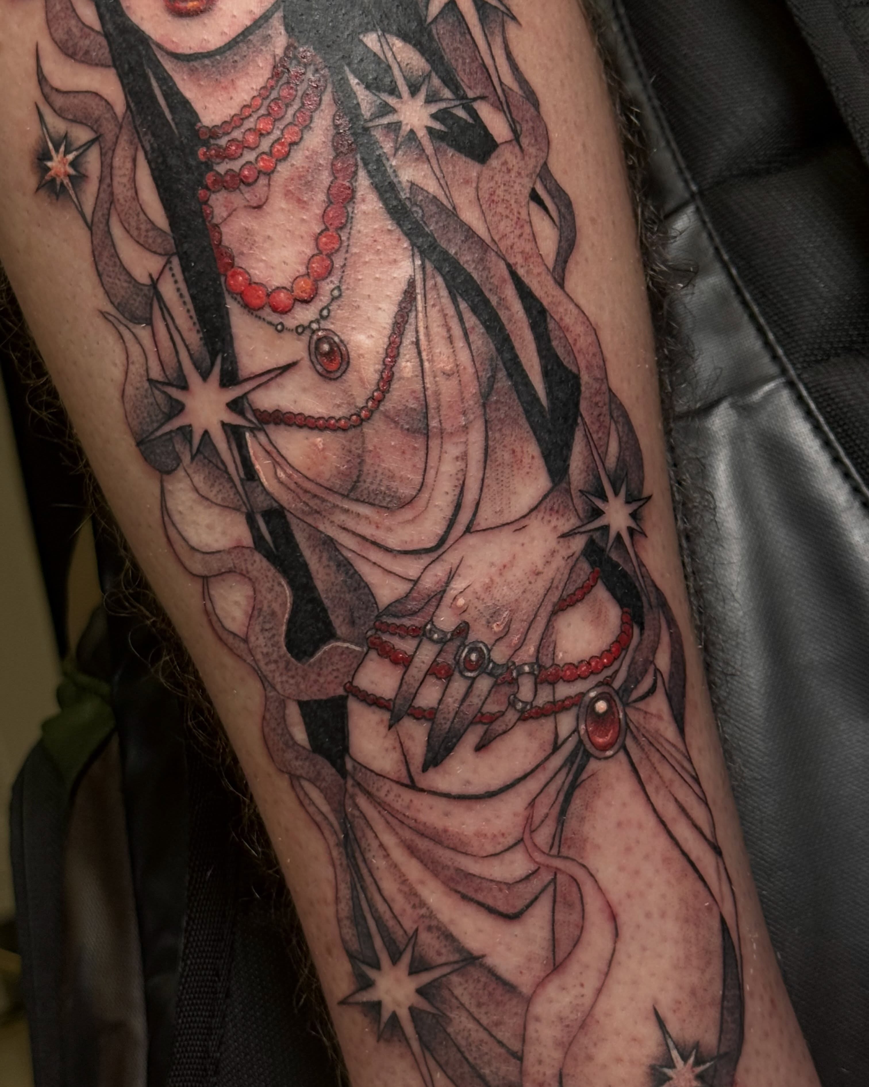 Woman with stars realism tattoo on the forearm by Christian