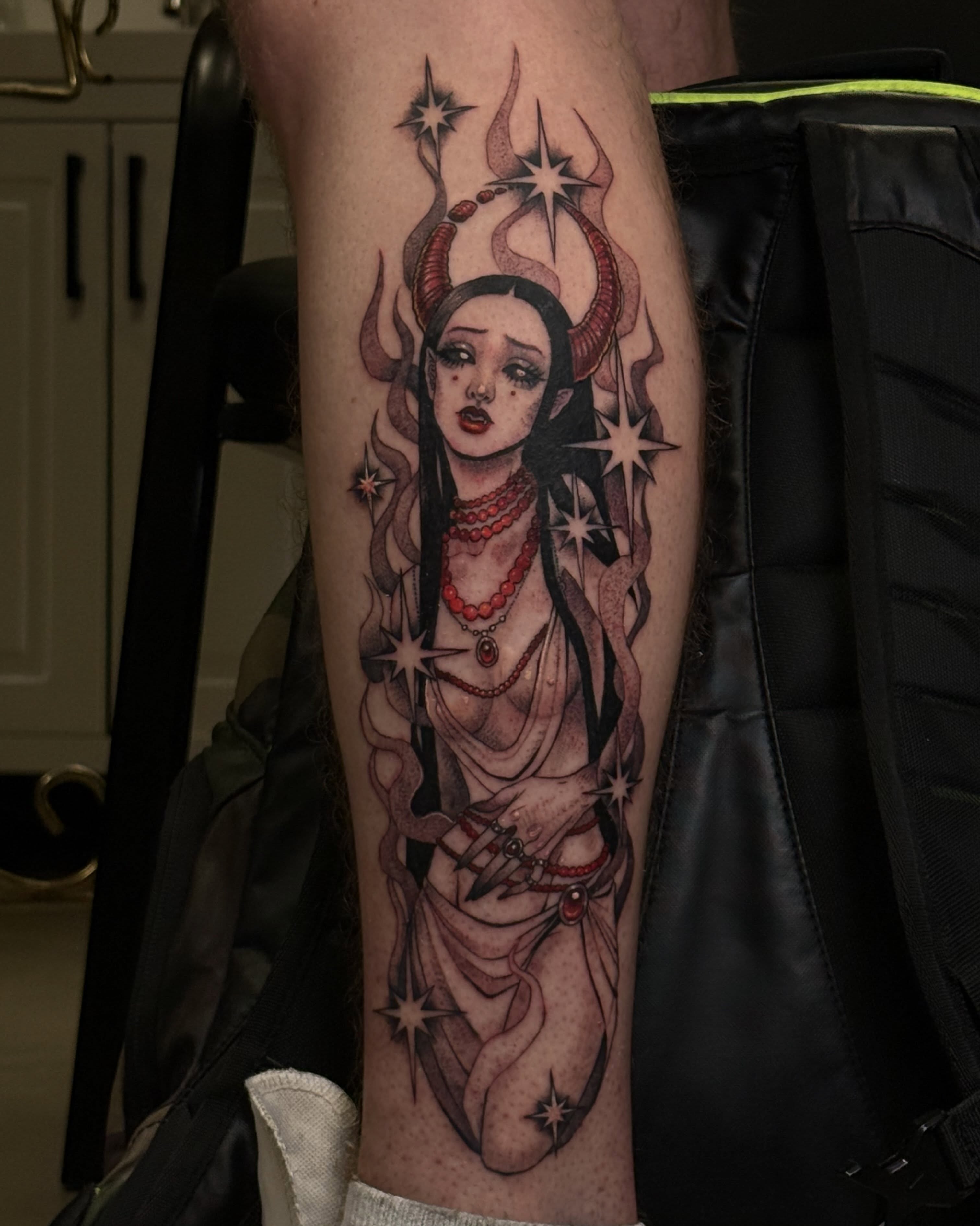Woman with horns dark realism tattoo on the forearm by Christian