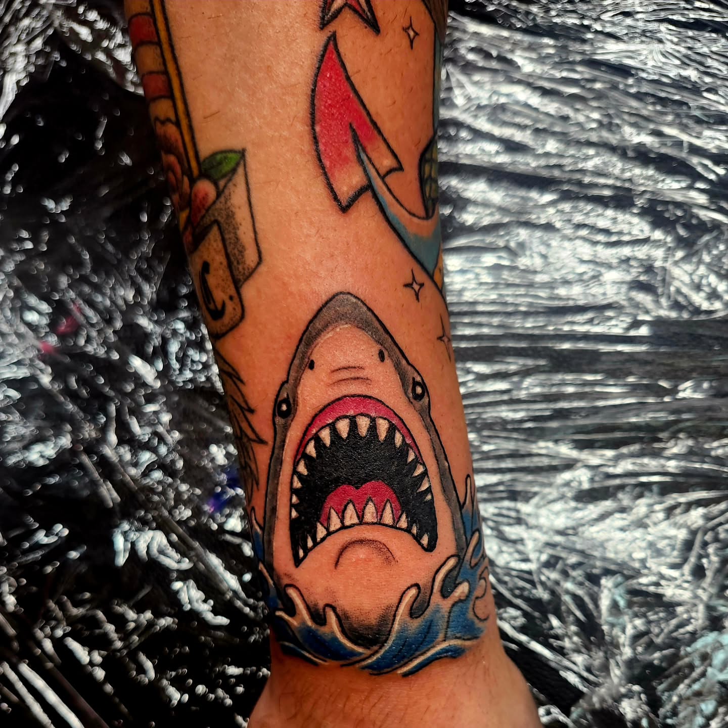 Shark American traditional tattoo on the forearm by @rockinr33d.tattoos