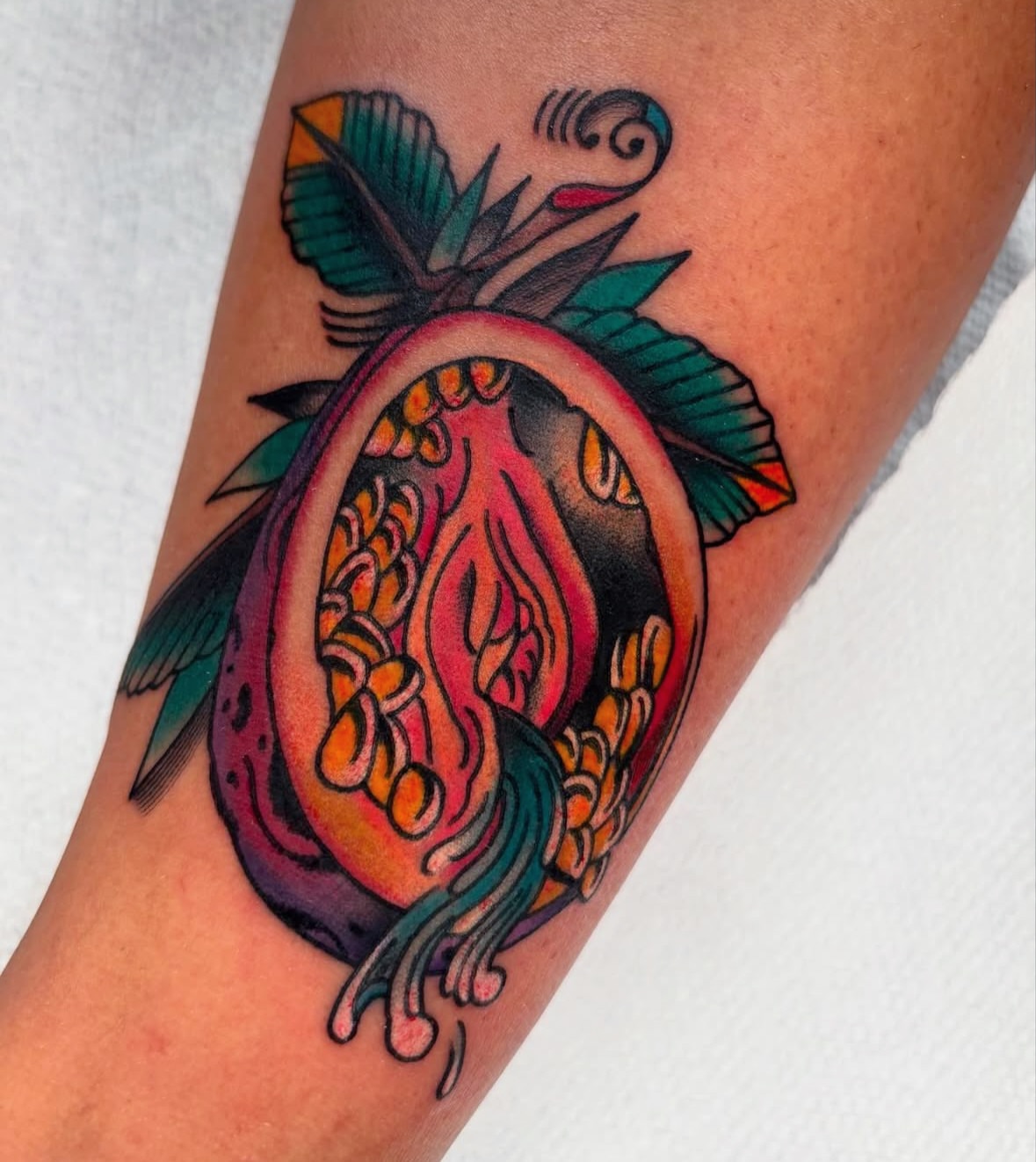 Passion fruit American traditional tattoo on the forearm by ericka bates