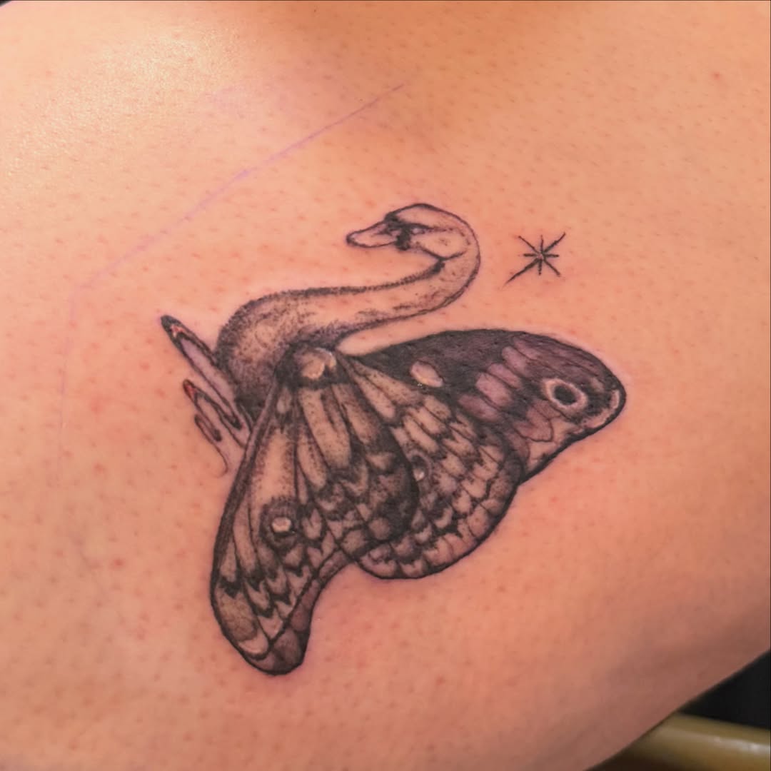 Moth and snake realism tattoo on the shoulder by Nina Nichole