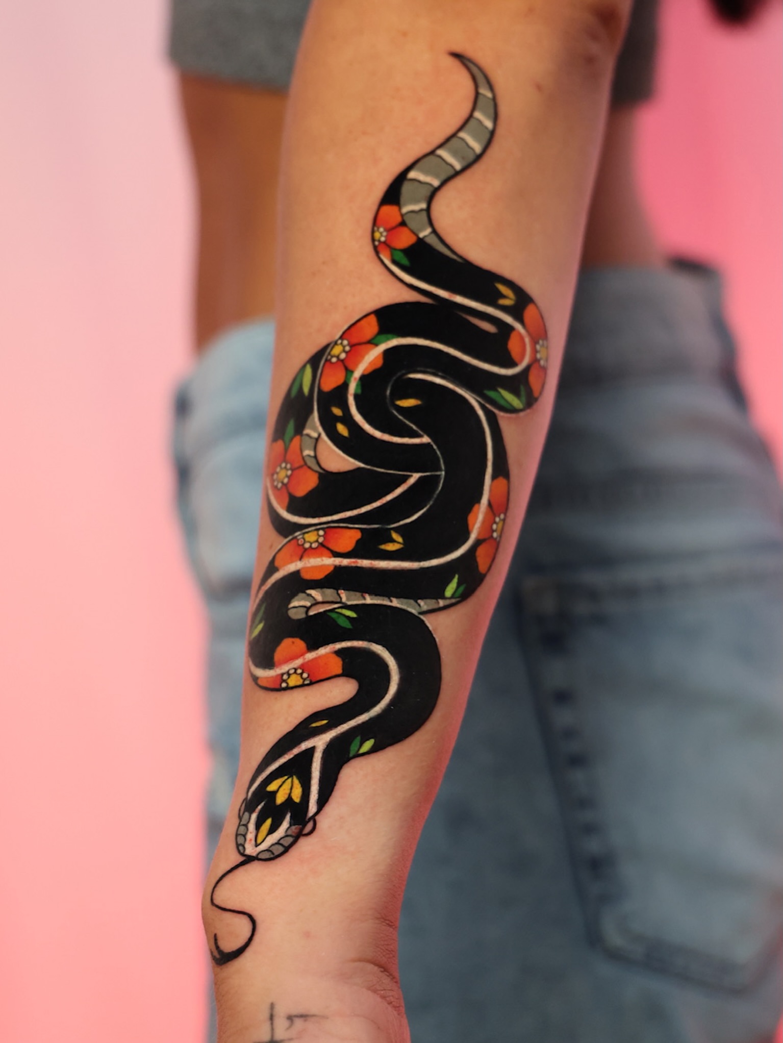Snake American traditional tattoo on the forearm by Chi, Charlotte, North Carolina