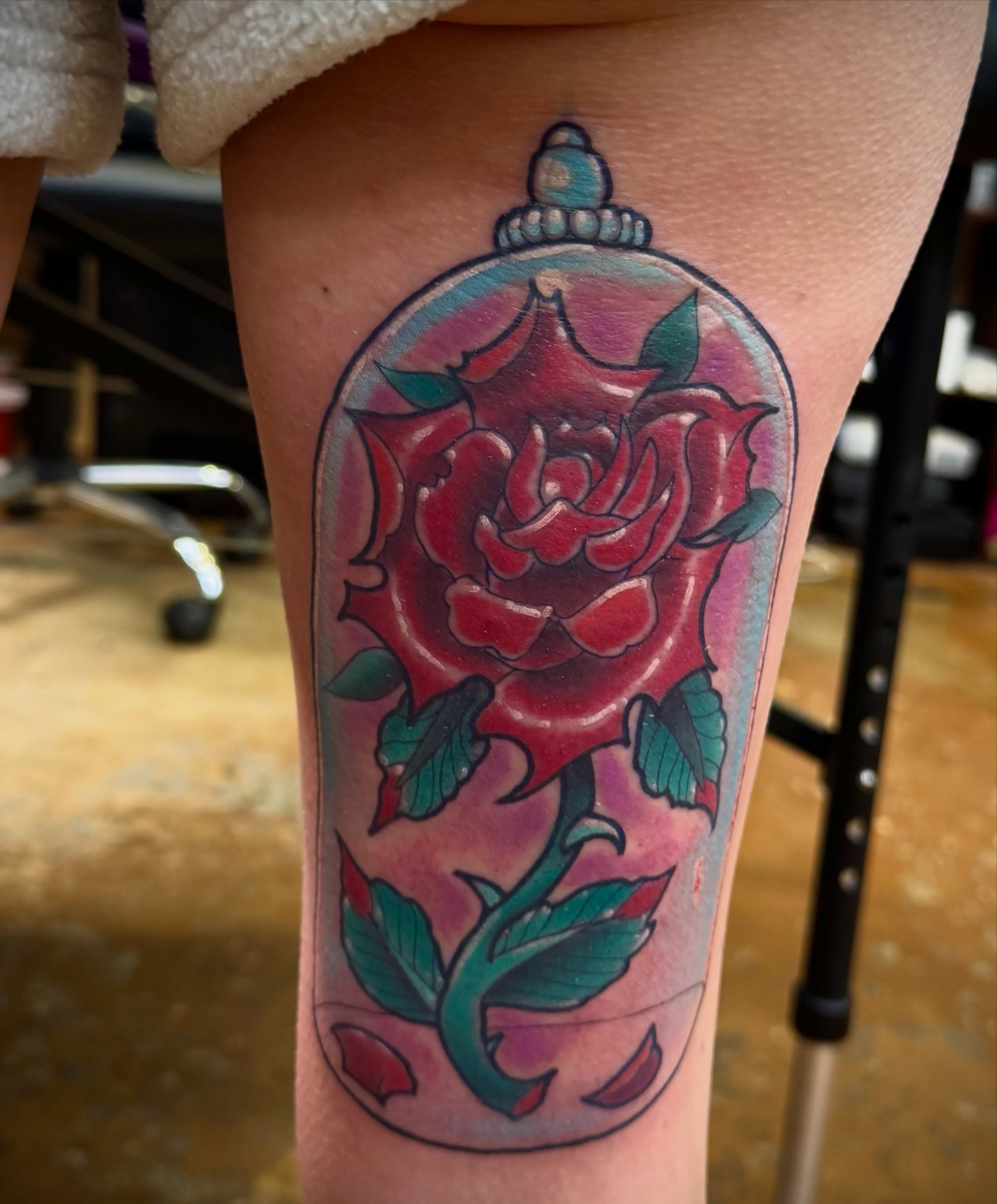 Rose American traditional tattoo on the thigh by David C. McGhee