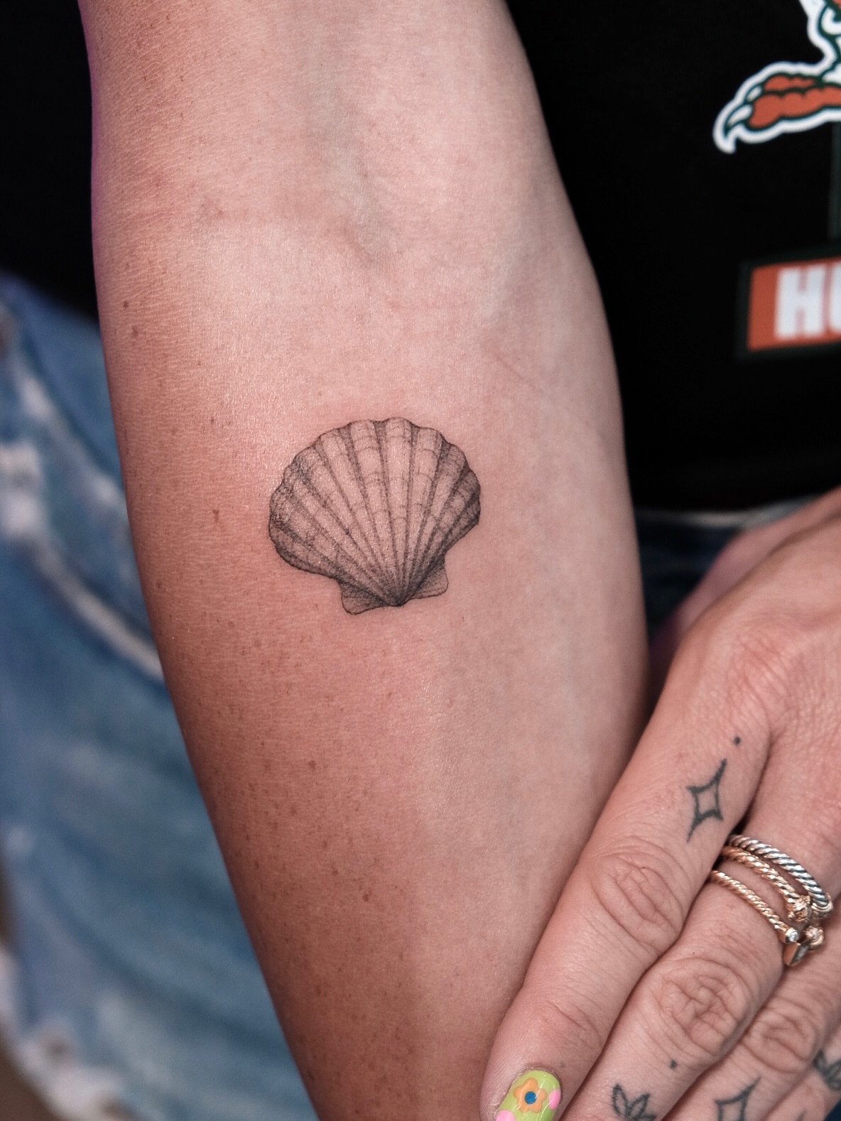 Shell black and grey tattoo on the forearm by Your tattoo Artist, New York, New York