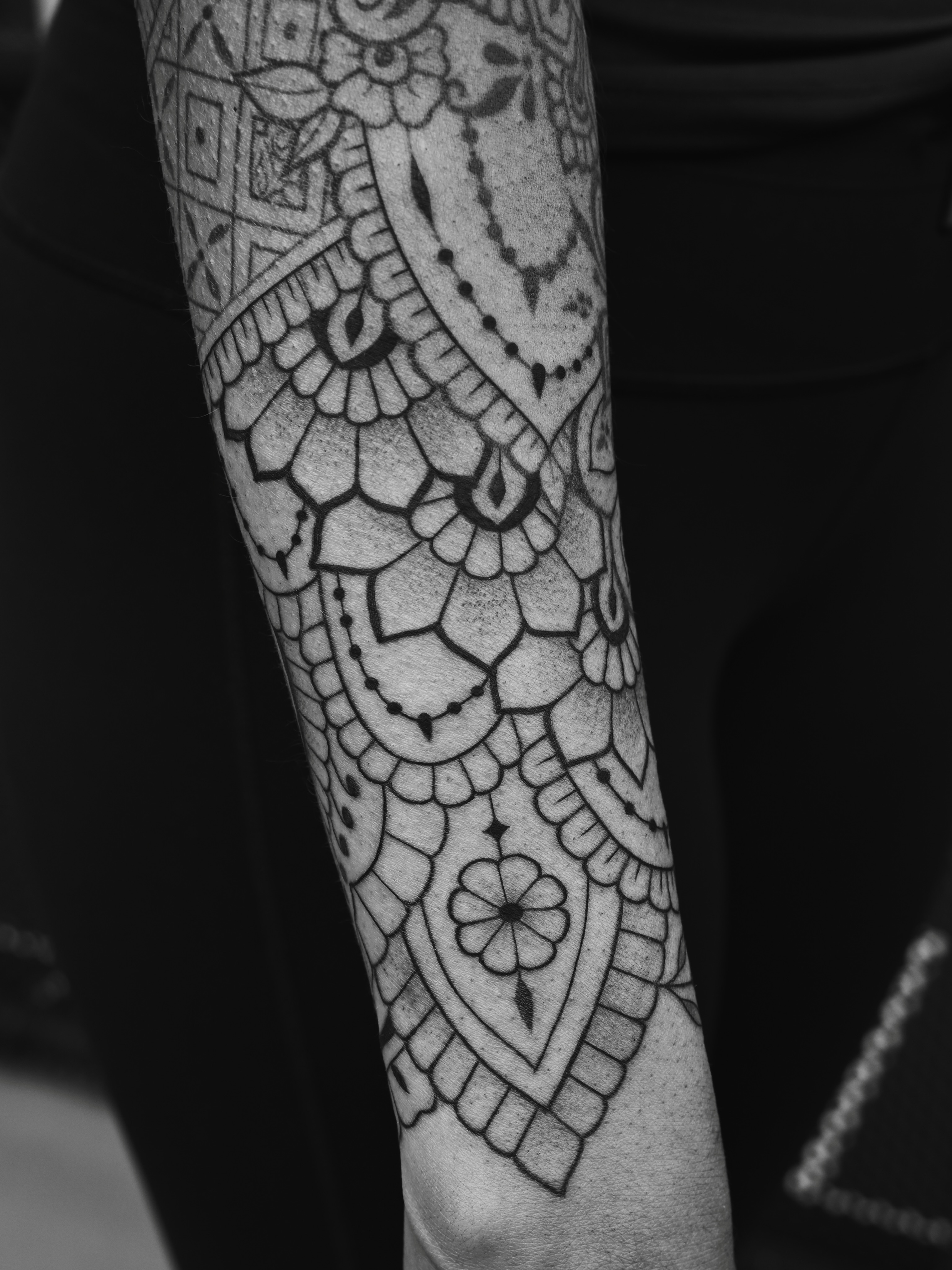 Lace pattern geometric tattoo on the forearm by Sabreena Haque