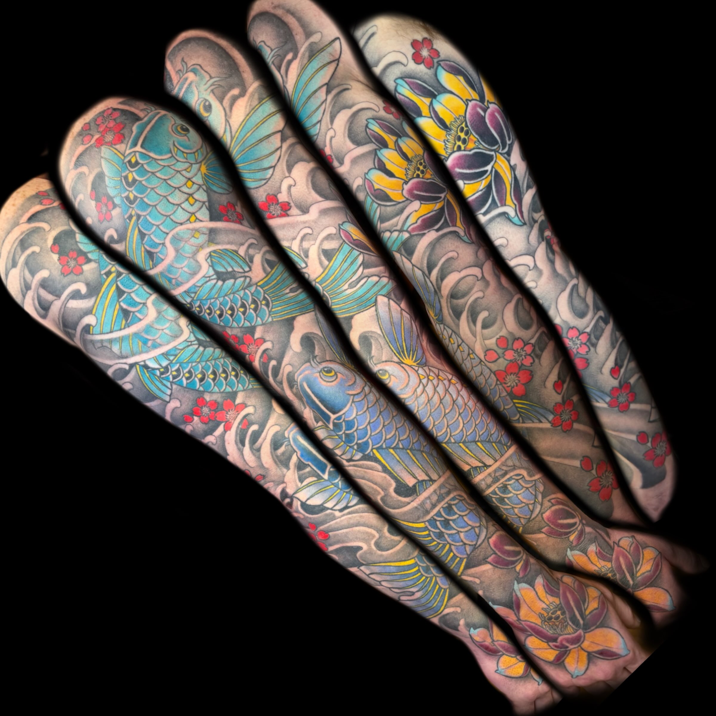 Koi fish and lotus flowers japanese irezumi tattoo on the upper arm by Kelsea Weir McCree