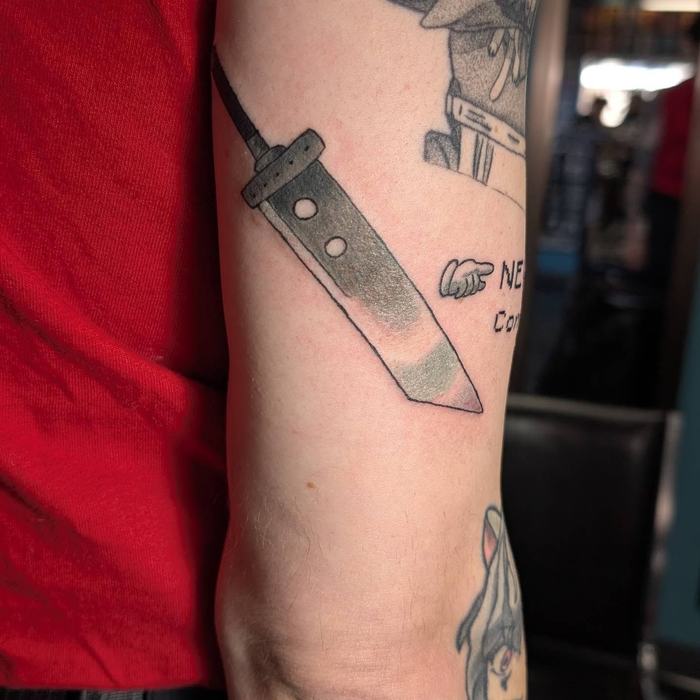 Knife black and grey tattoo on the forearm by norn noszka