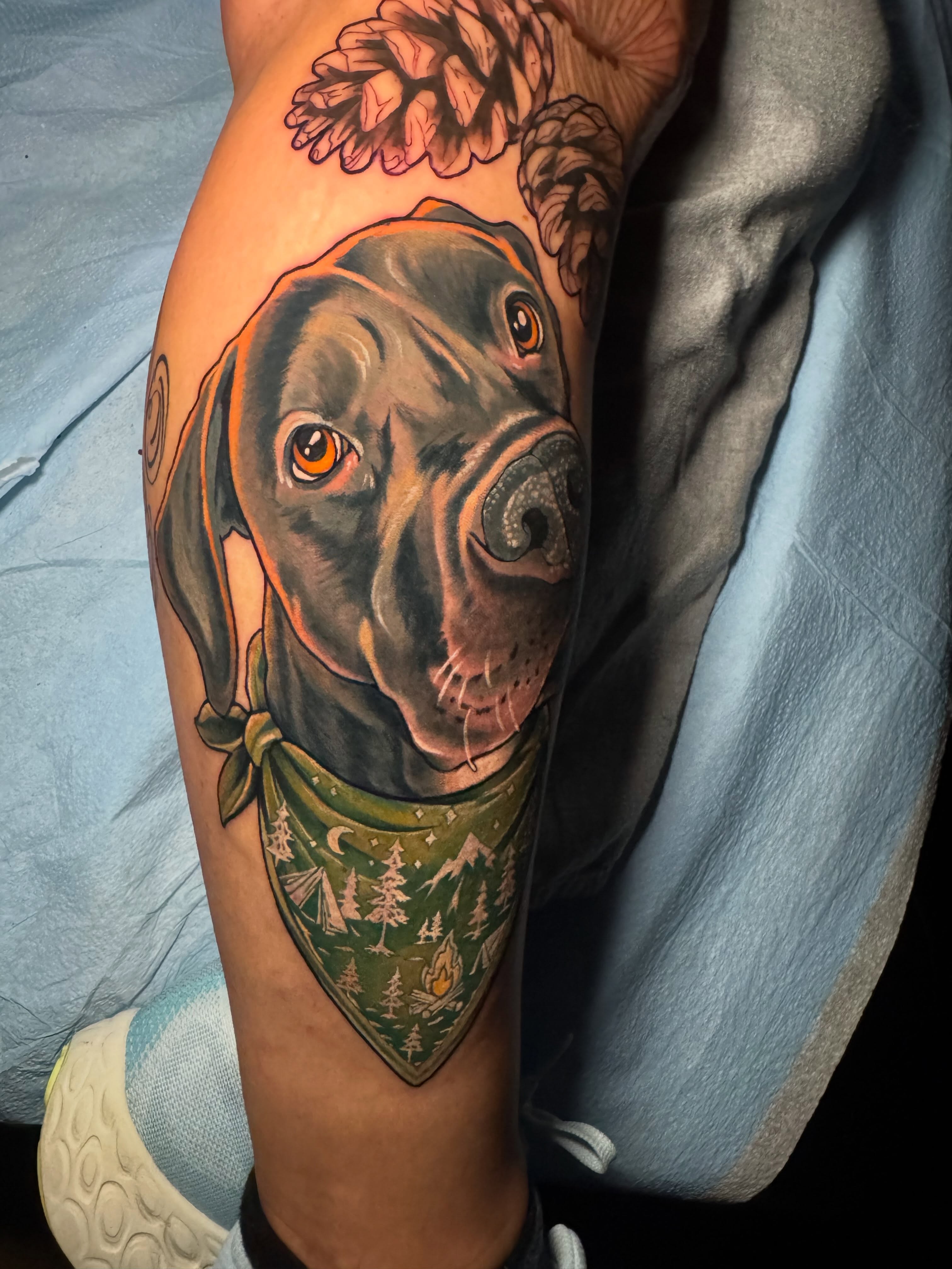 Dog with bandana realism tattoo on the forearm by Steve Gentile Tattoos