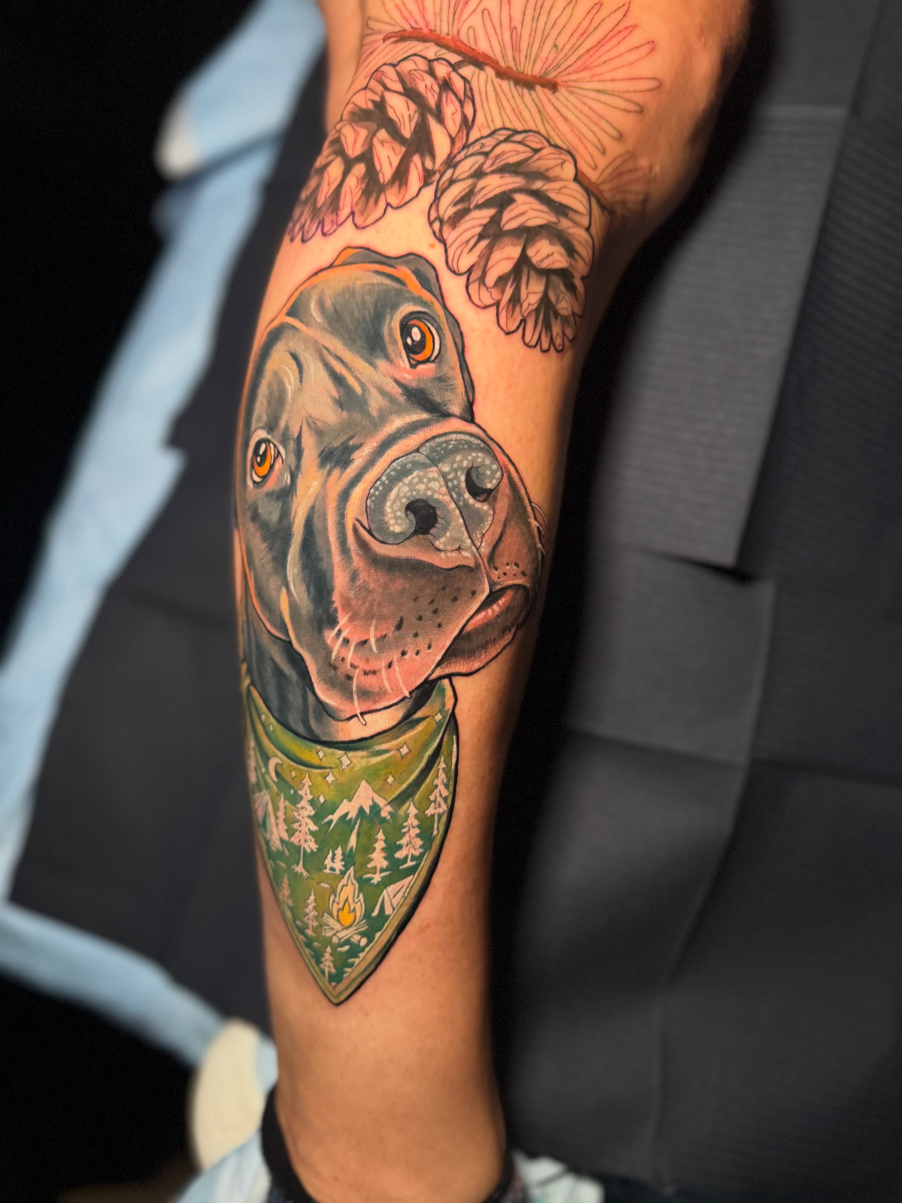 Dog wearing bandana realism tattoo on the forearm by Steve Gentile Tattoos
