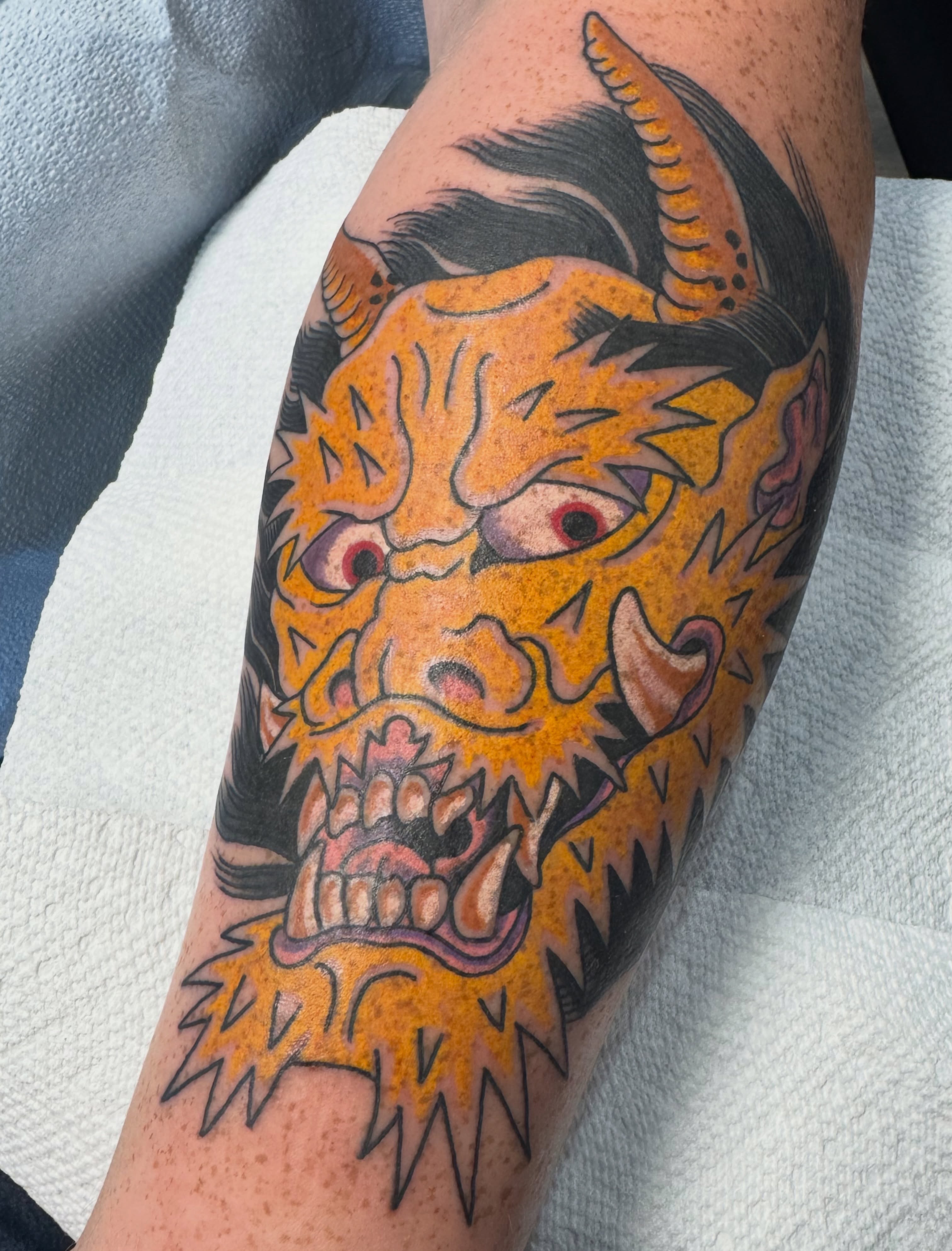 Demon head American traditional tattoo on the forearm by Timothy Wood