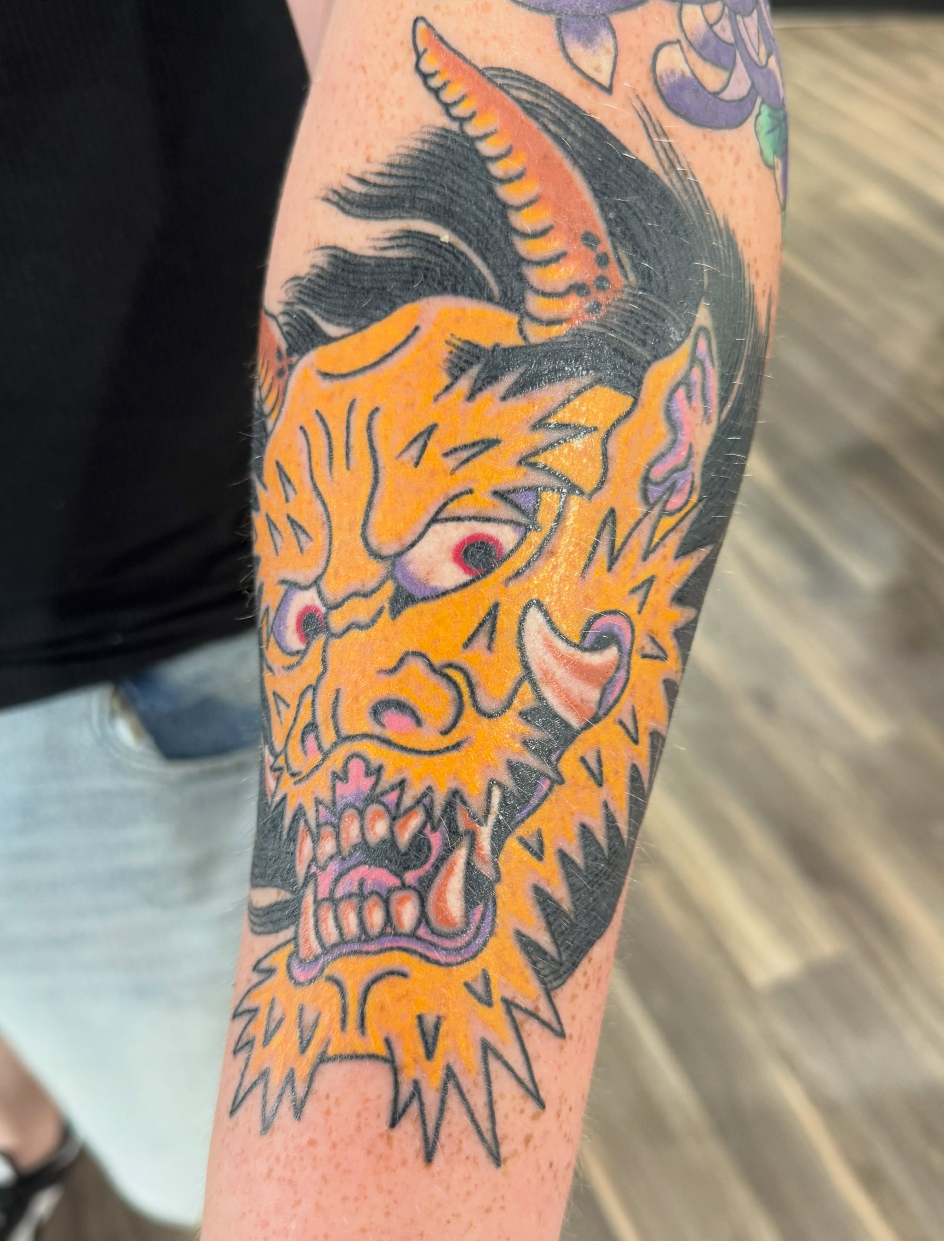 Demon head American traditional tattoo on the forearm by Timothy Wood