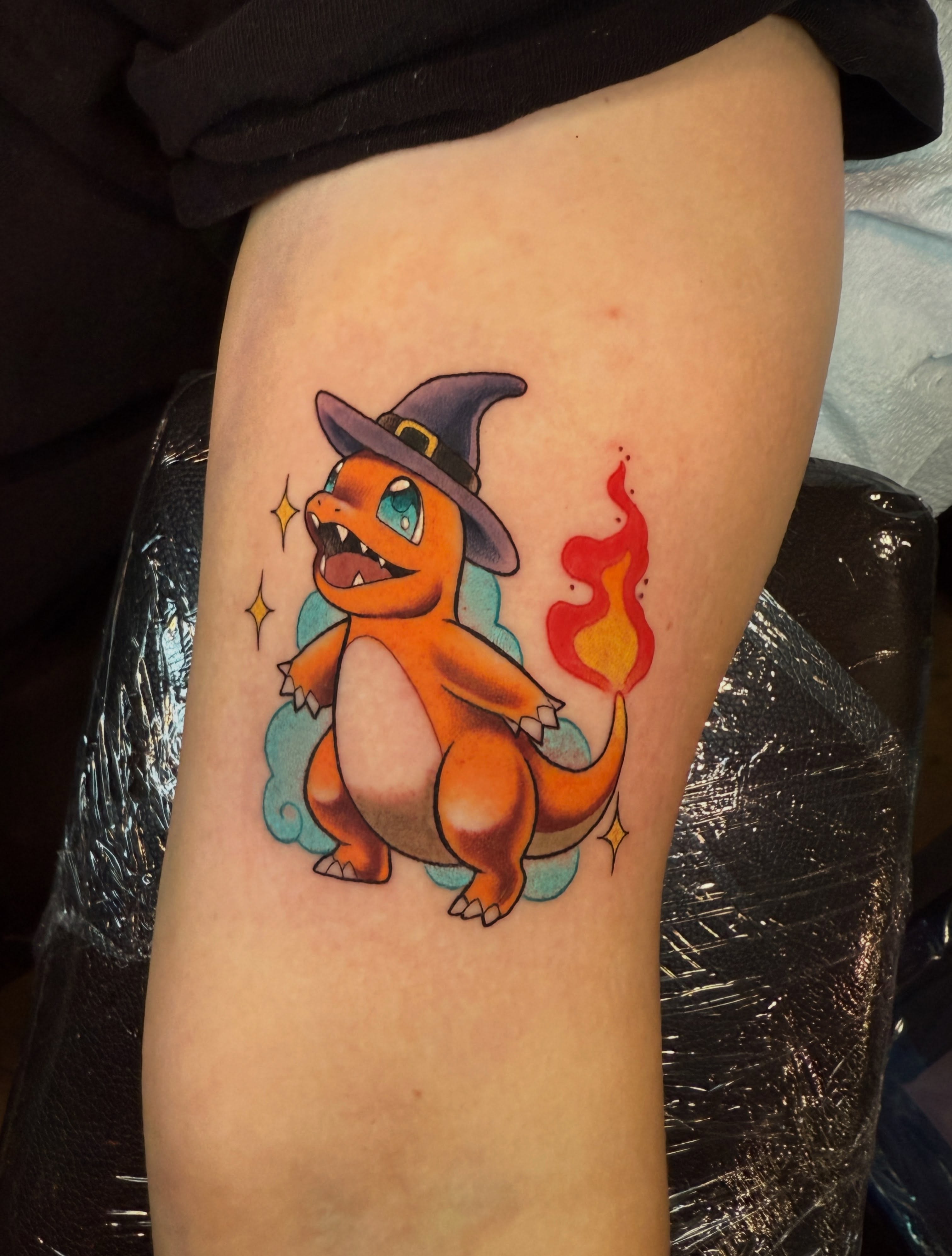 Charmander new school tattoo on the thigh by Skye Kimball