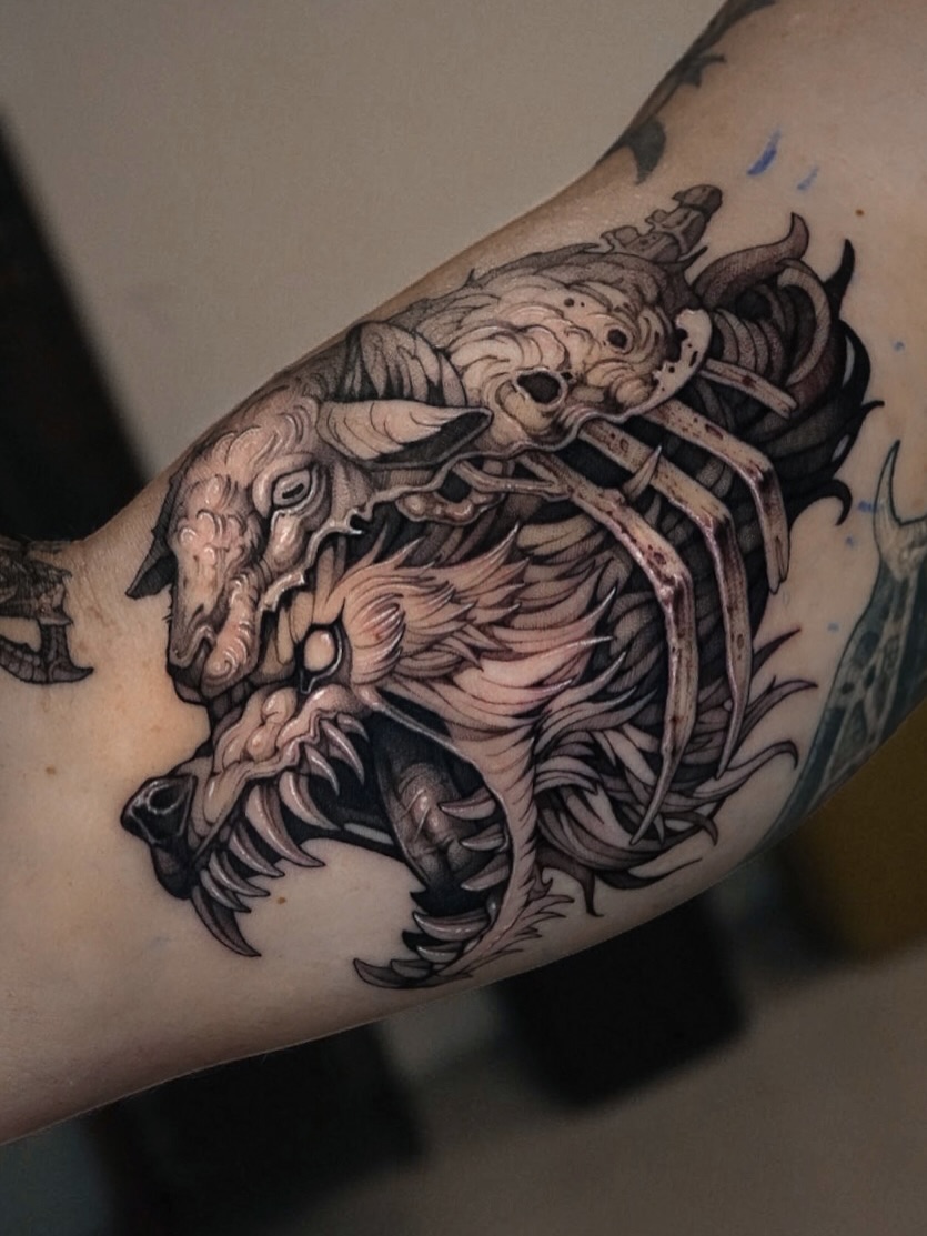 Monster dark realism tattoo on the forearm by Blackwork A P S O