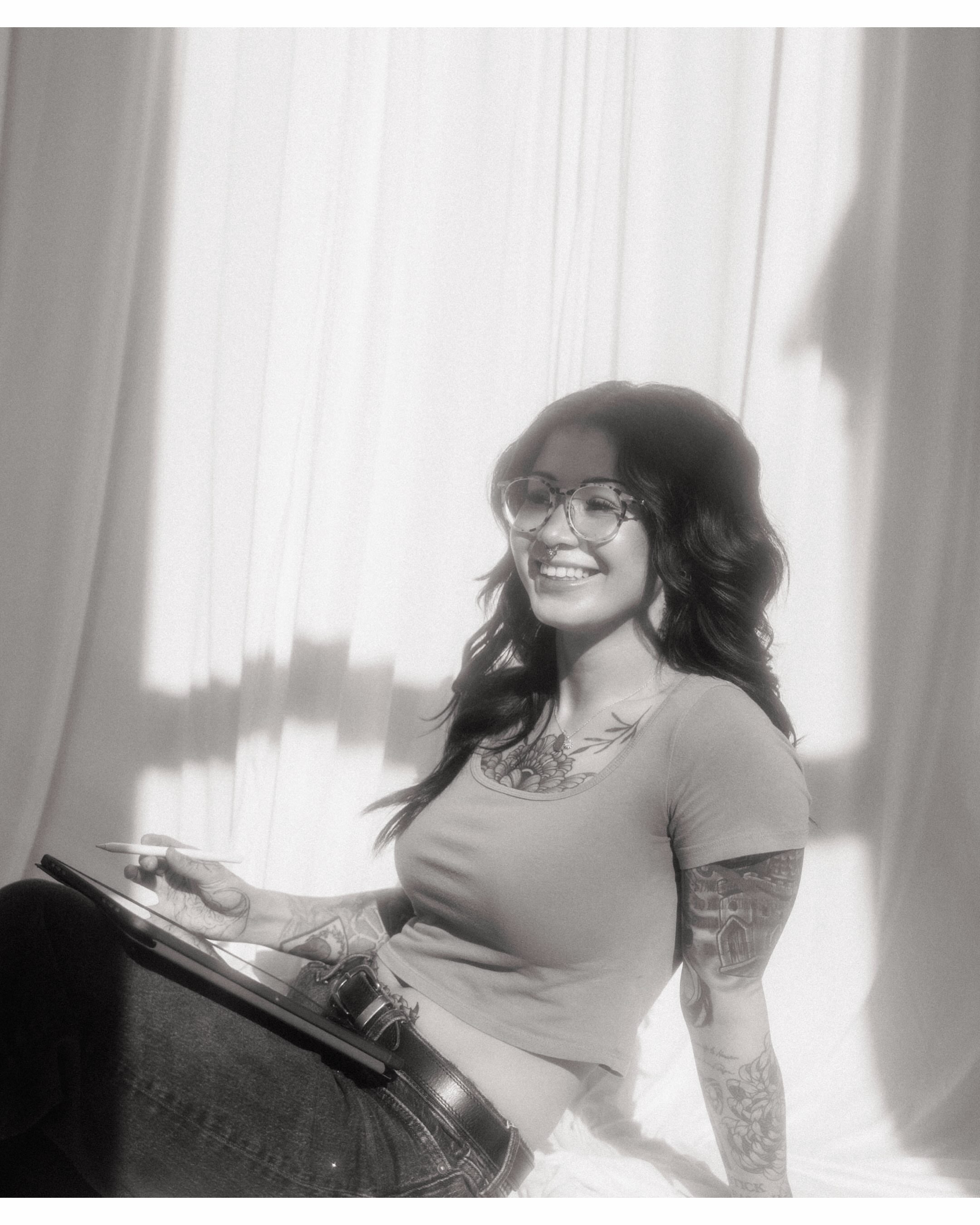 Tattooed arm black and grey tattoo on the upper arm by Ashley Lambert