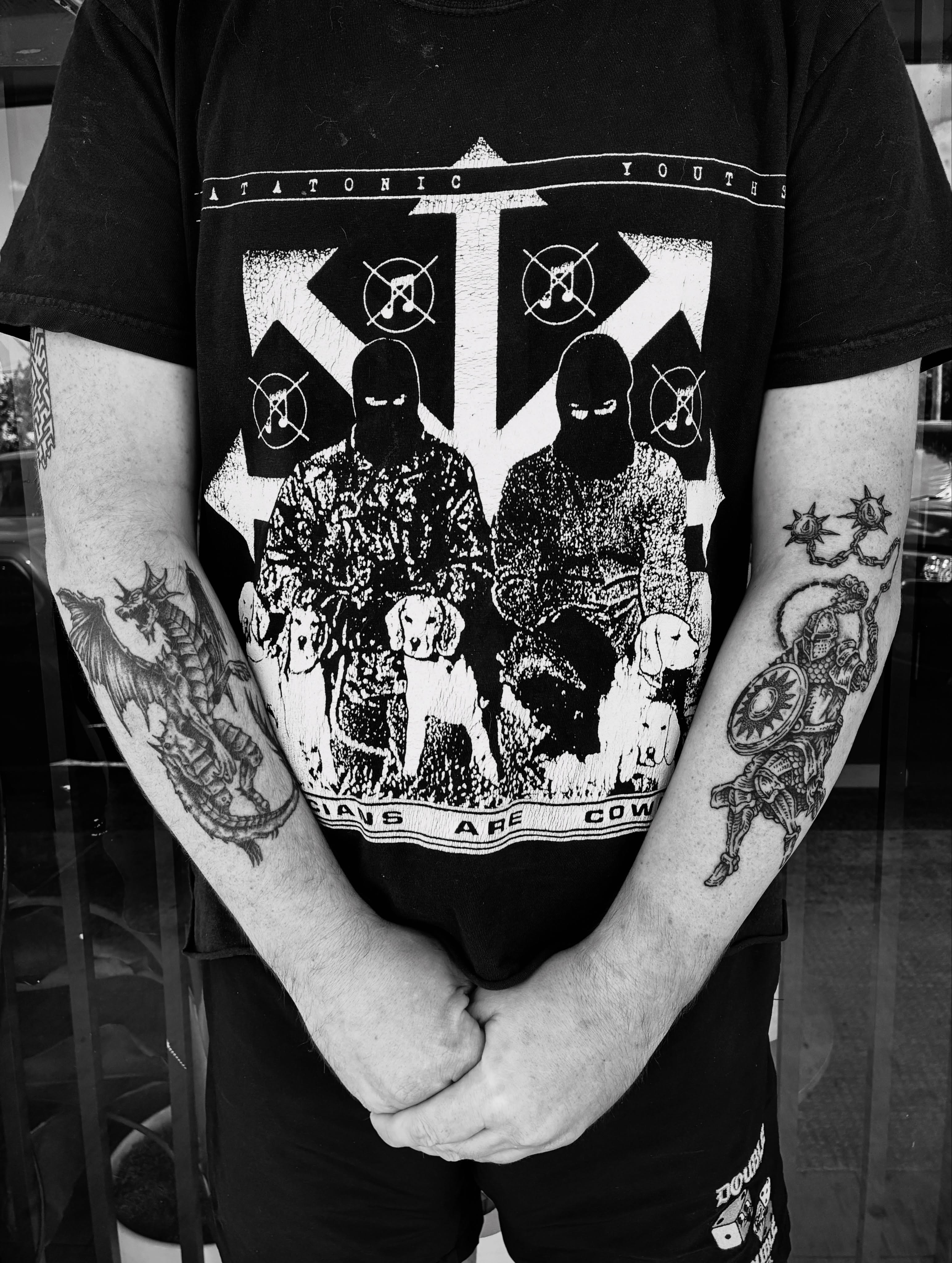 Dogs and balaclavas black and grey tattoo on the forearm by Zachary R Bobkoff