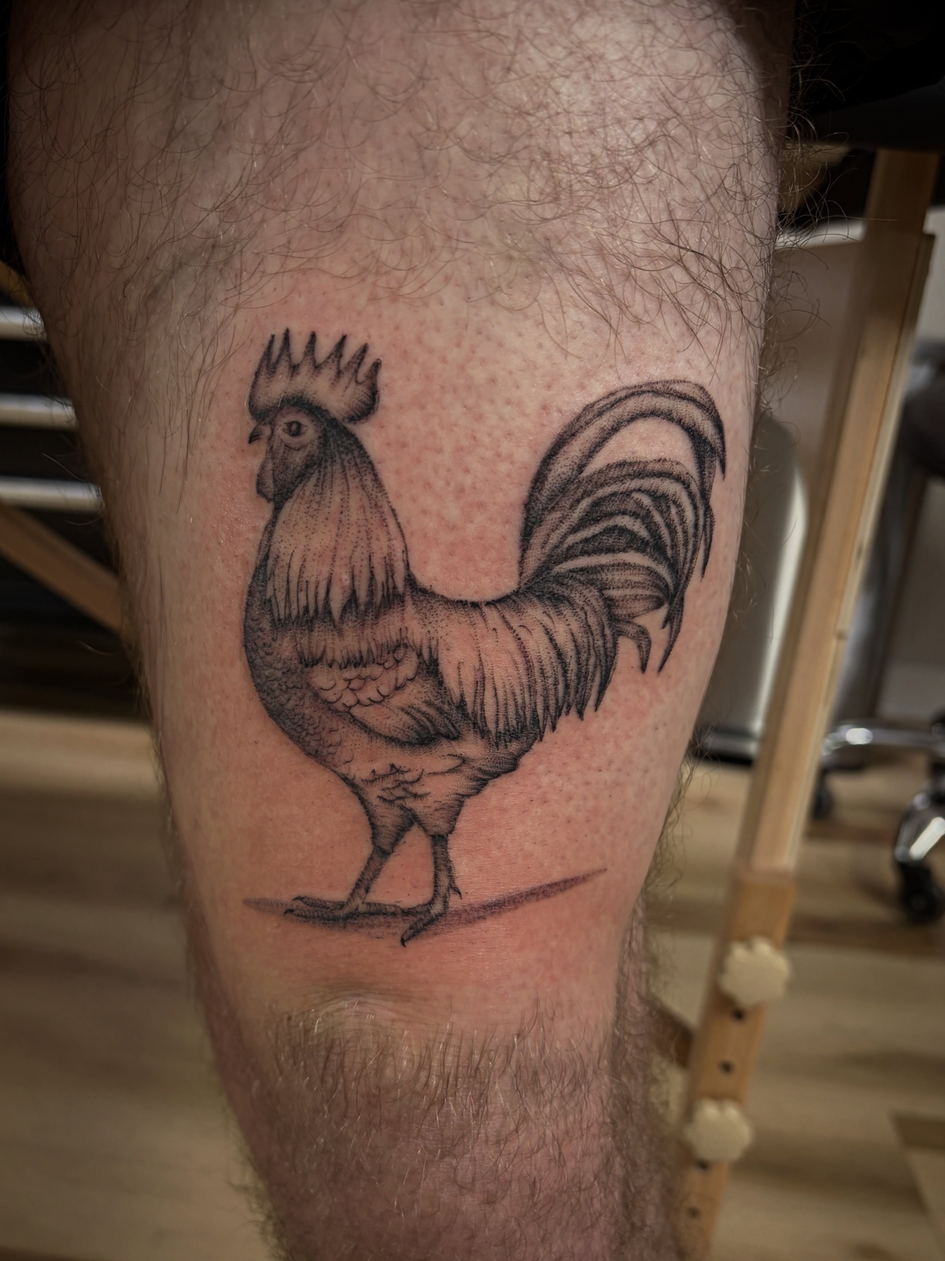 Rooster black and grey tattoo on the thigh by Francesca Siwa