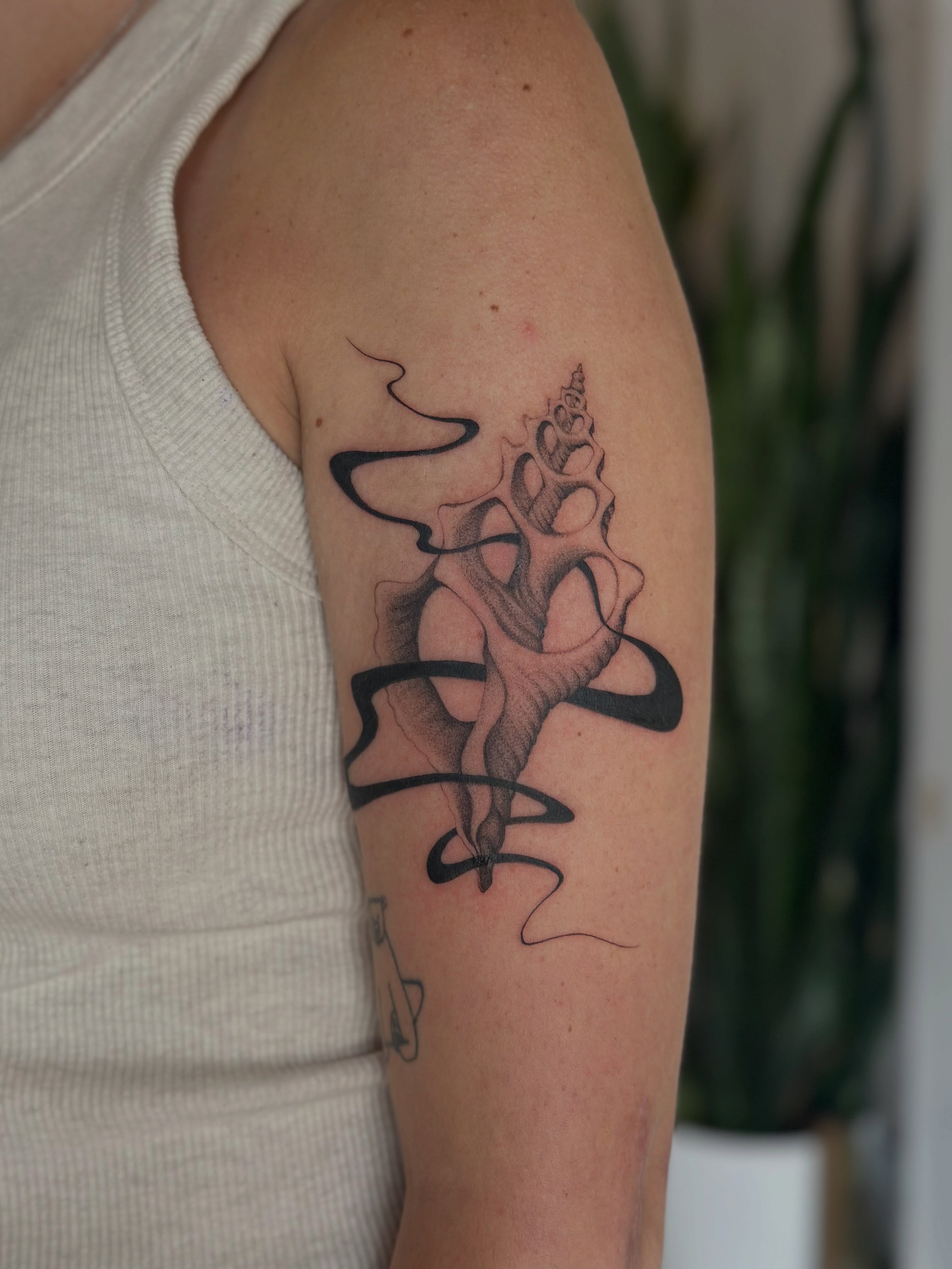 Abstract figure black and grey tattoo on the forearm by sara scak, Lakewood, Ohio