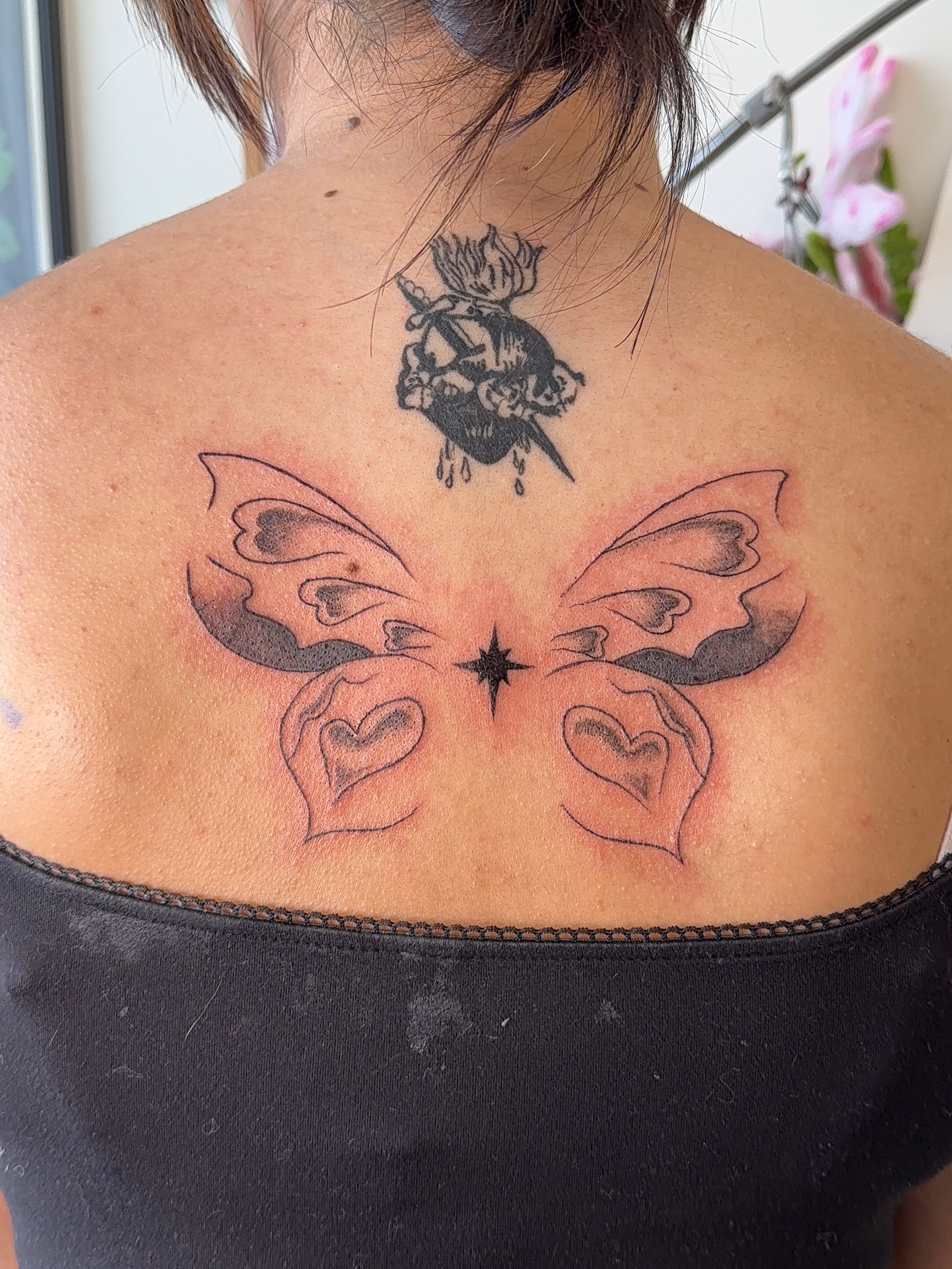 Butterfly with hearts black and grey tattoo on the back by nova ♡ˎˊ˗ tattoo apprentice