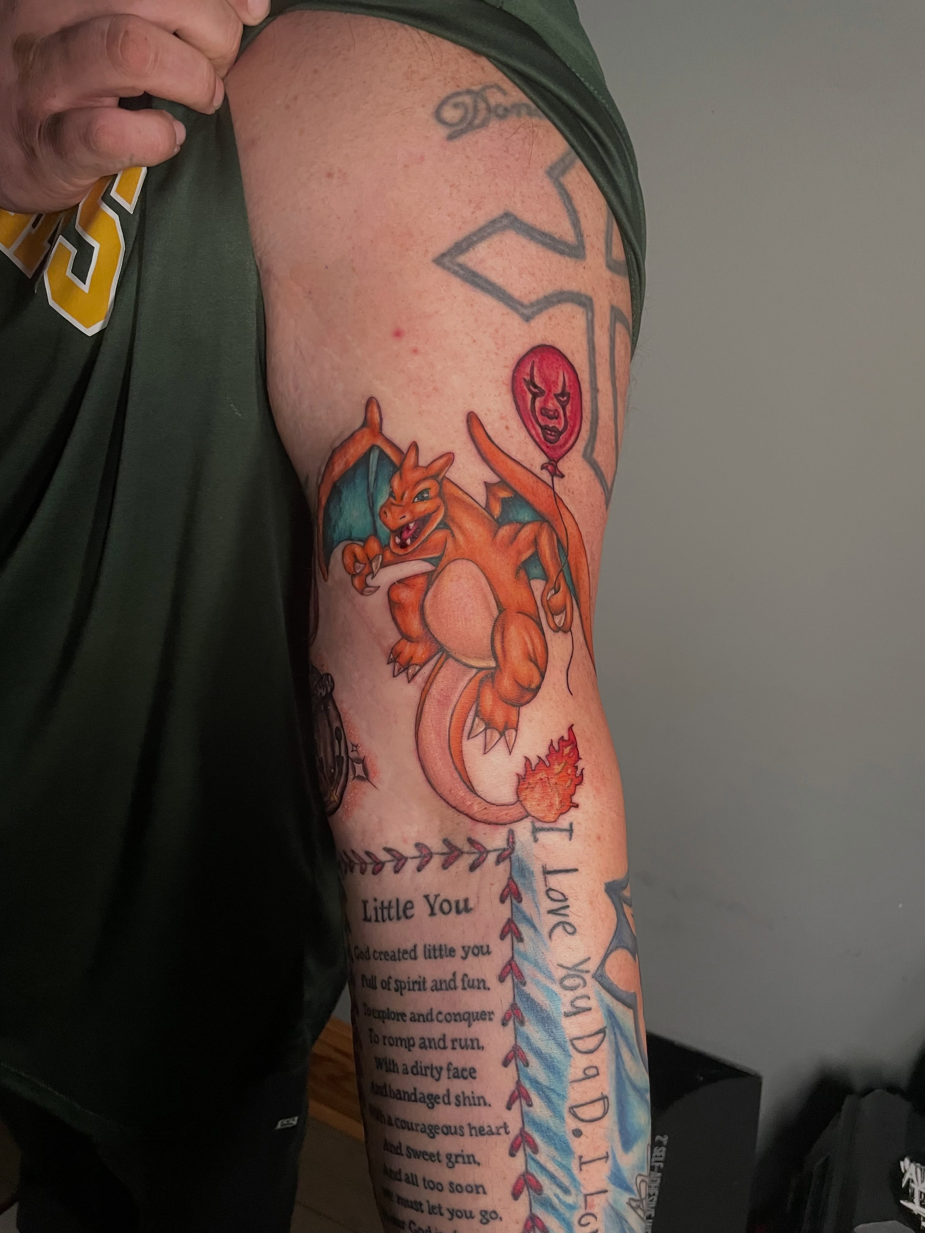 Dragon and balloon realism tattoo on the forearm by Hannah Copeskey
