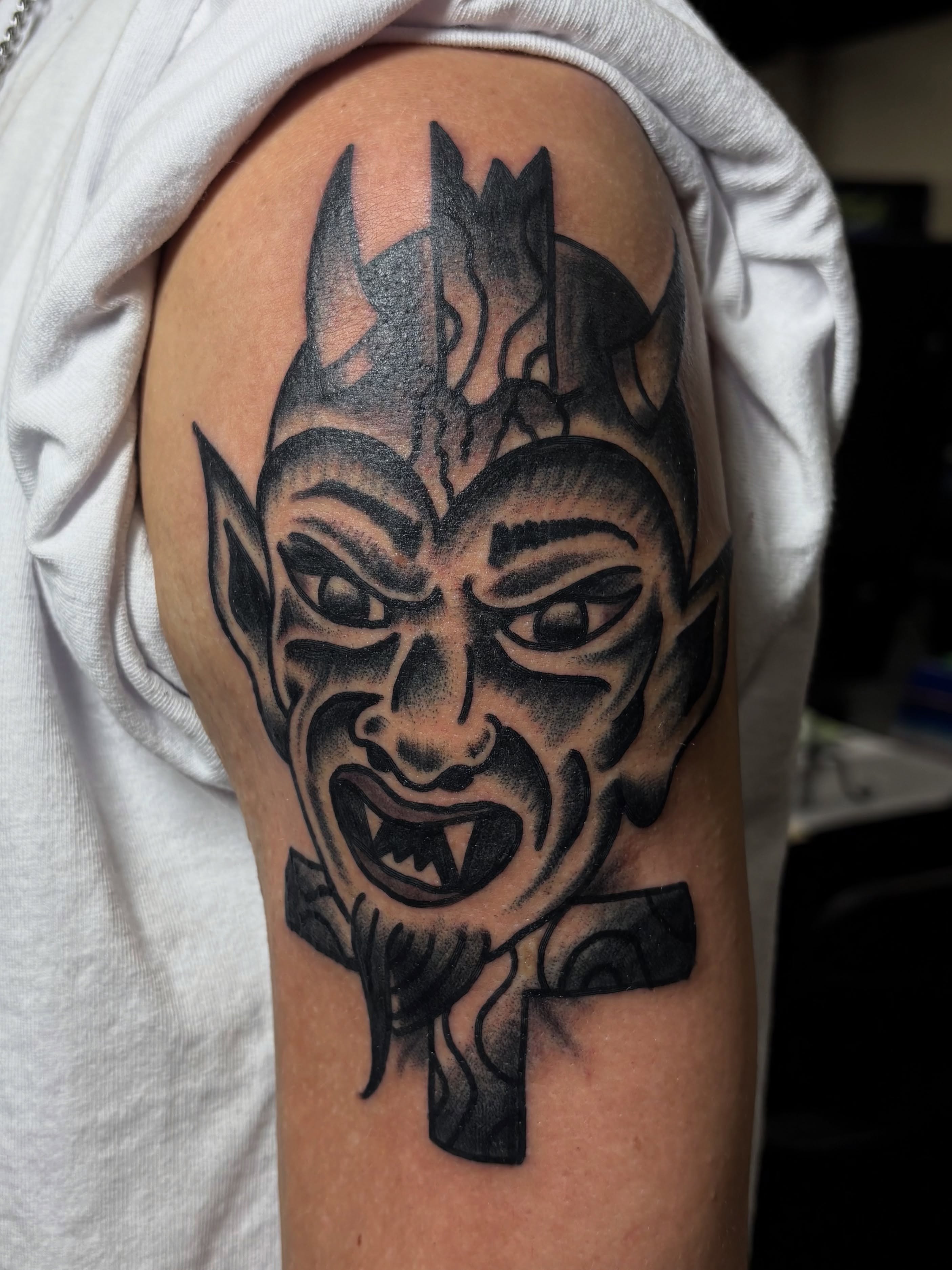 Demon face black and grey tattoo on the shoulder by Jake Herbert, Knoxville, Tennessee