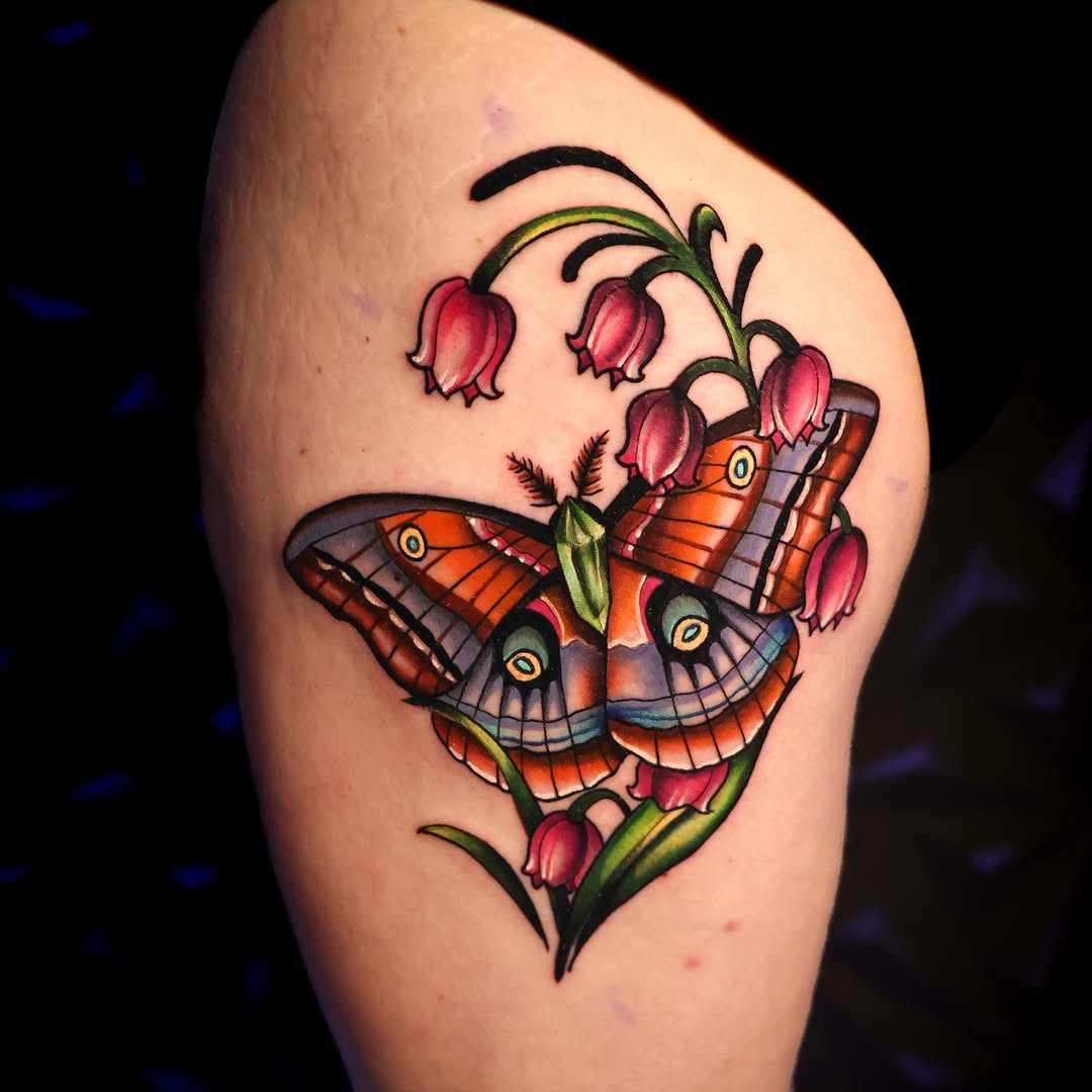 Butterfly and flowers American traditional tattoo on the shoulder by Haleigh Cunningham, Charlotte, North Carolina