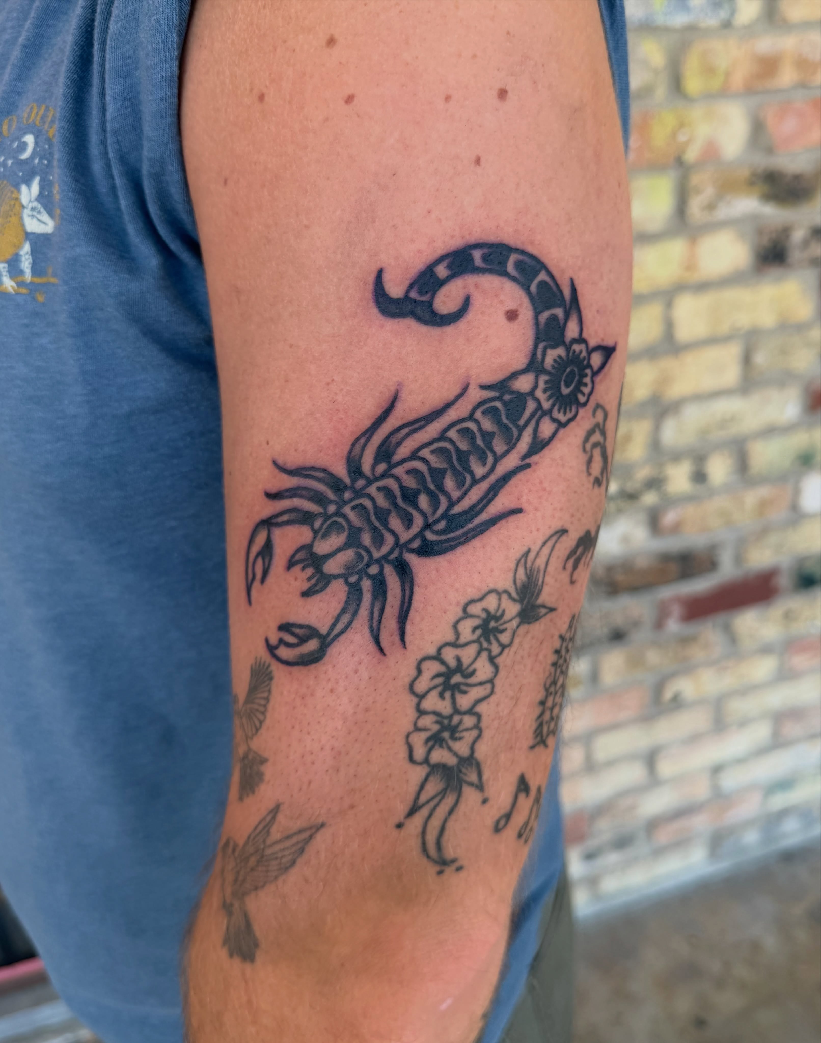 Scorpion black and grey tattoo on the forearm by Myka King