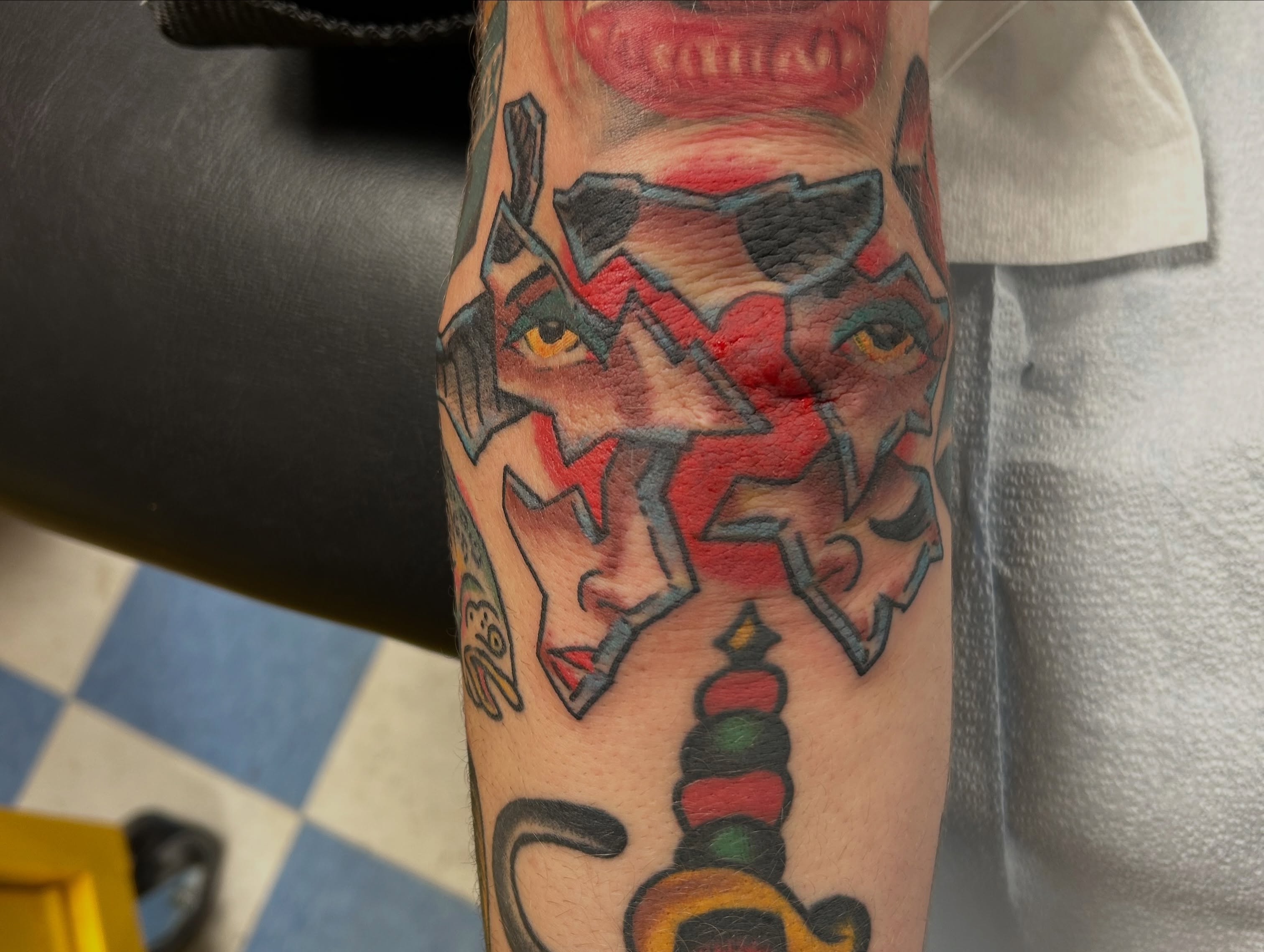 Geometric wolf geometric tattoo on the forearm by Mike "Yogi" Trube