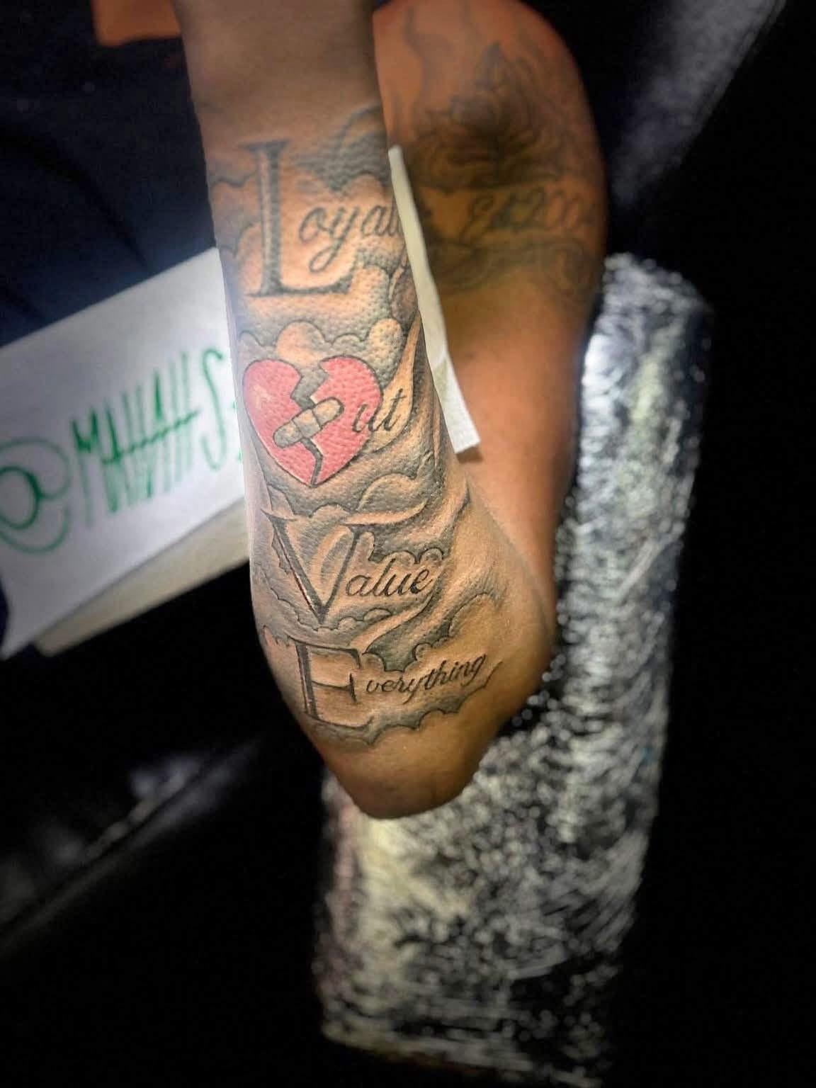 Heart with hands black and grey tattoo on the forearm by 🔥Matt Tatts 313🔥