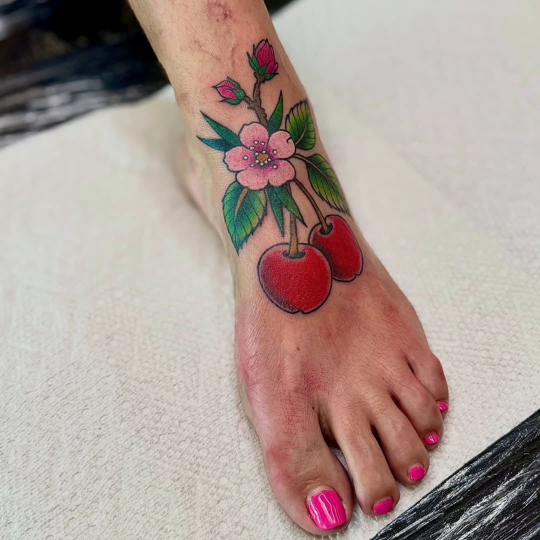 Cherry blossom new school tattoo on the foot by Jamie Hall, Kansas City, Missouri