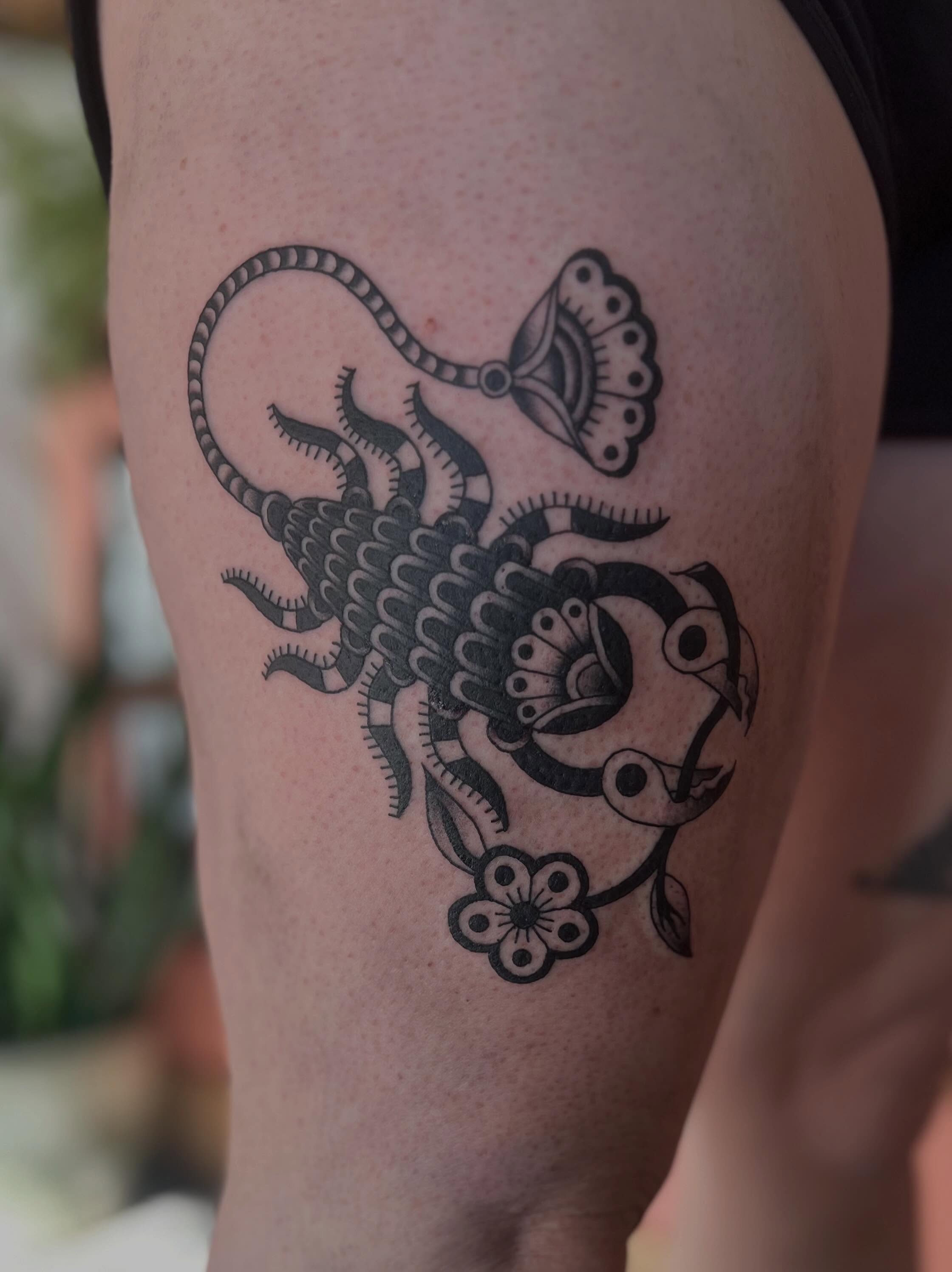 Scorpion black and grey tattoo on the thigh by David Stein