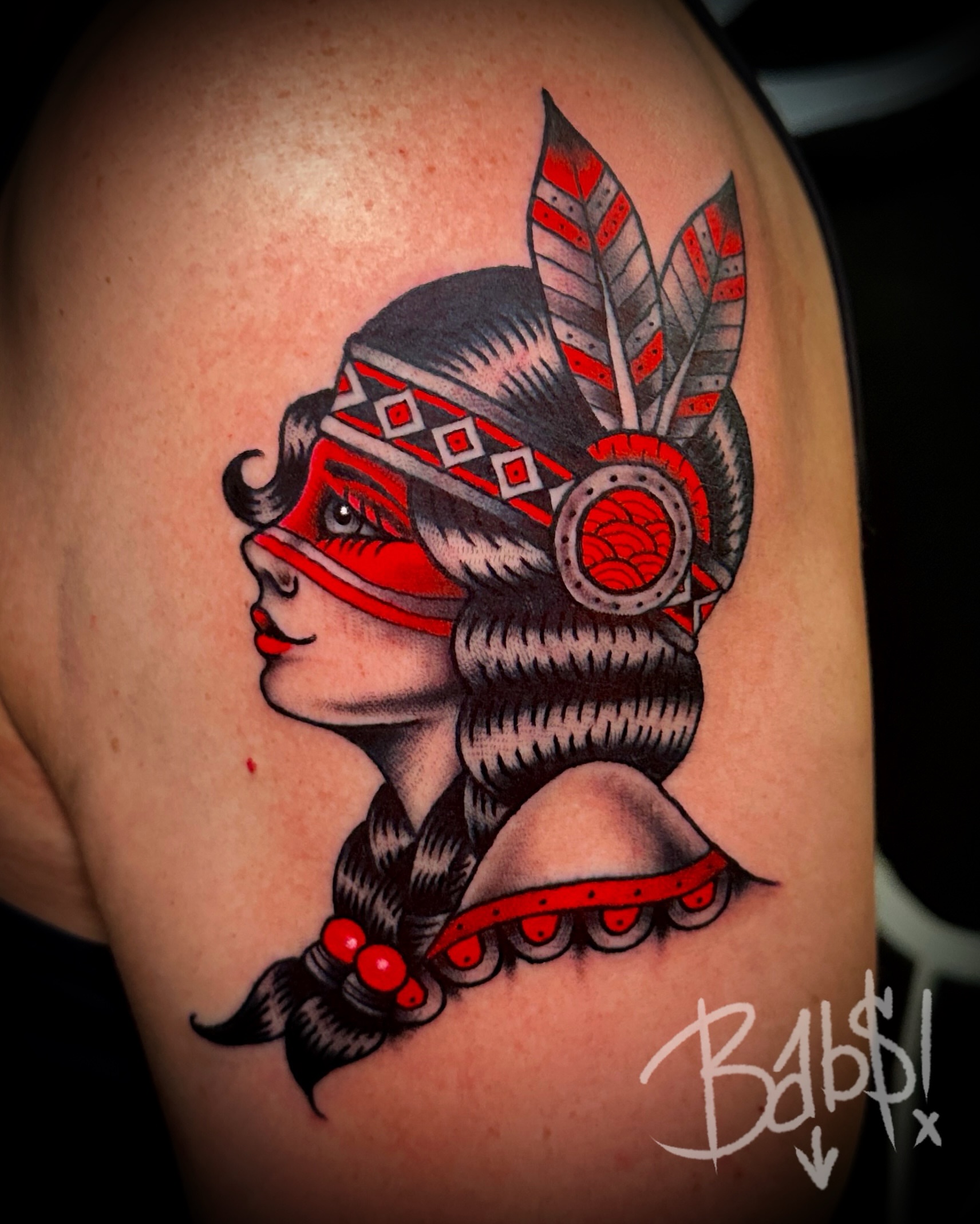 Indian headdress American traditional tattoo on the shoulder by Justin B