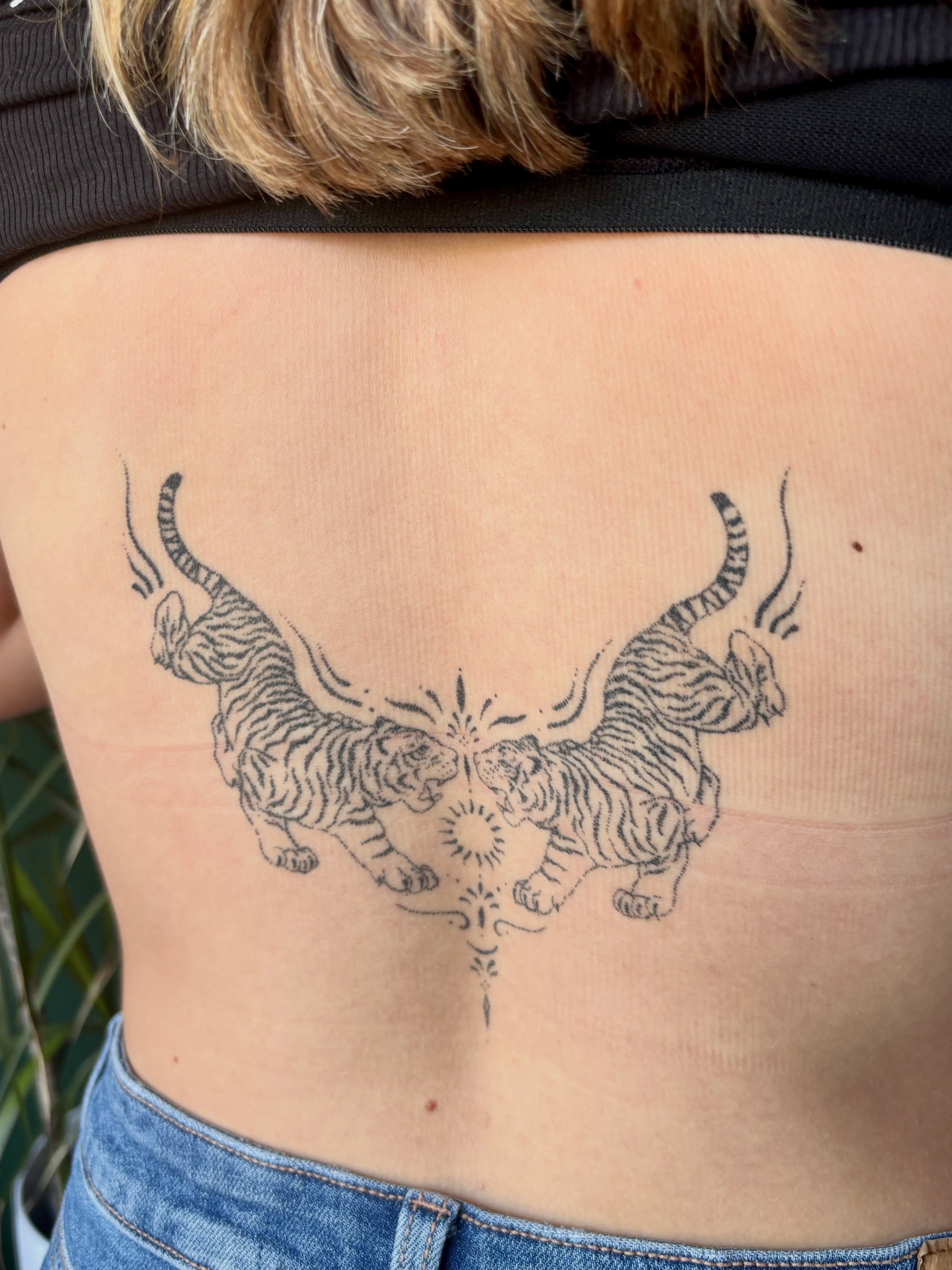 Tigers black and grey tattoo on the back by Ashley, Elk Horn, Iowa