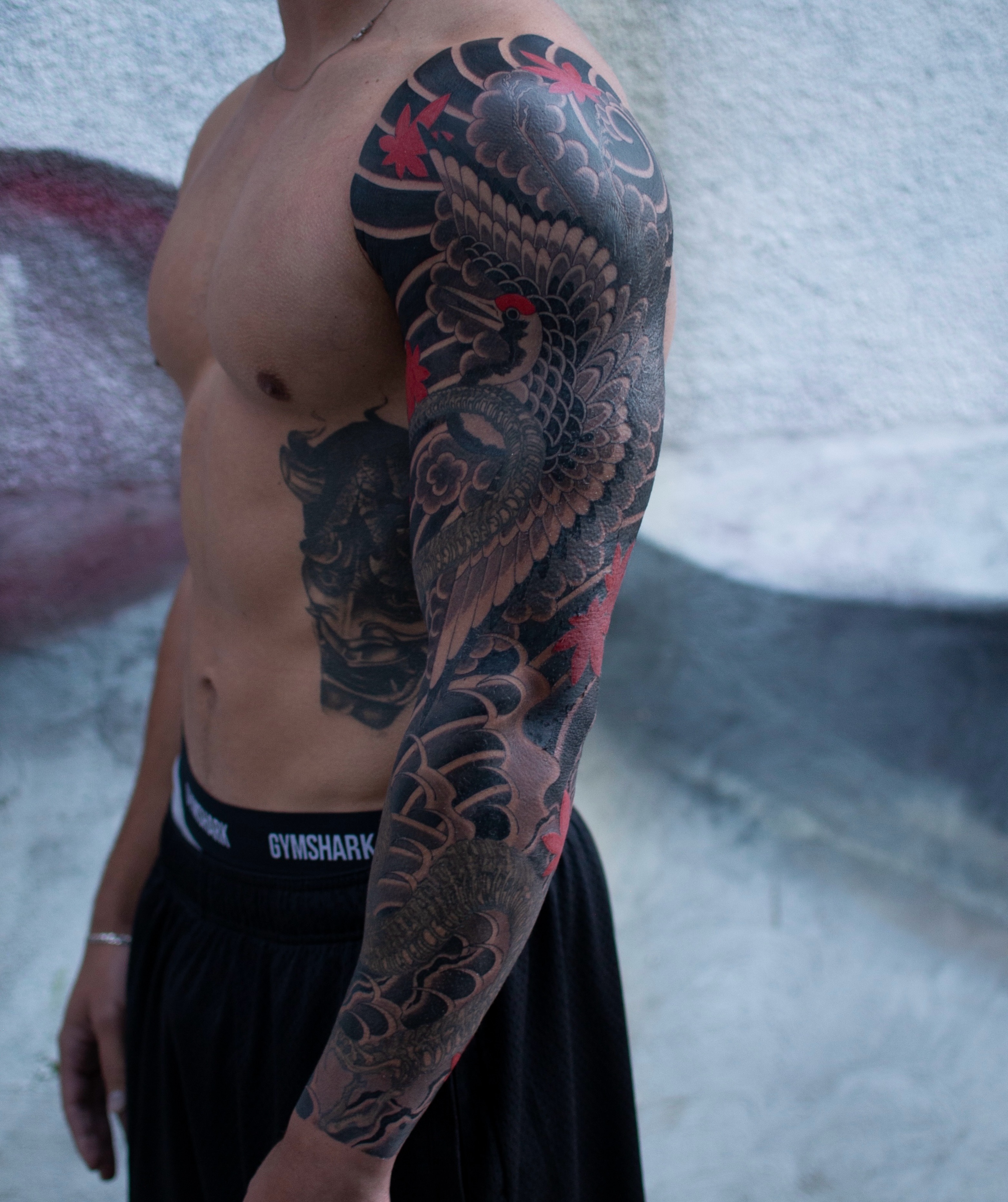 Bird and floral japanese irezumi tattoo on the upper arm by zak brochu, Windsor, Ontario