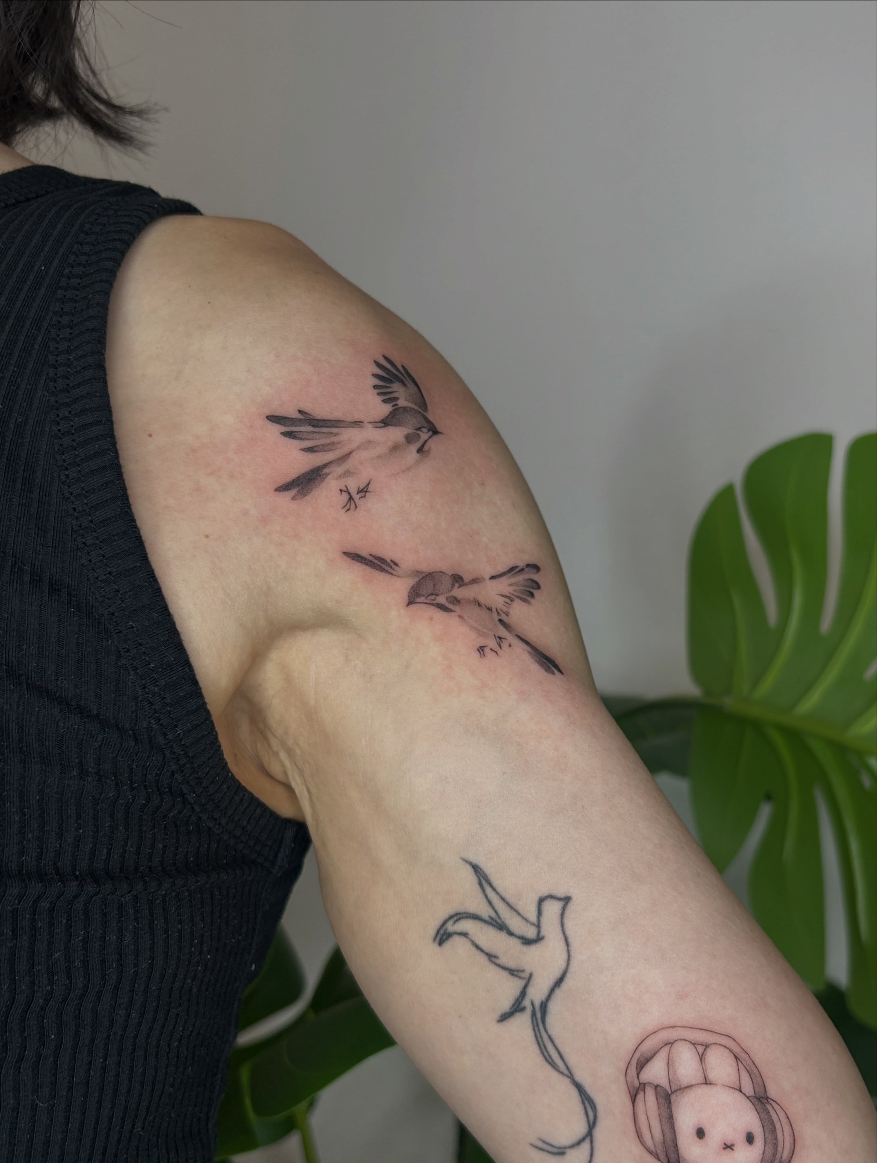 Birds black and grey tattoo on the forearm by Miri
