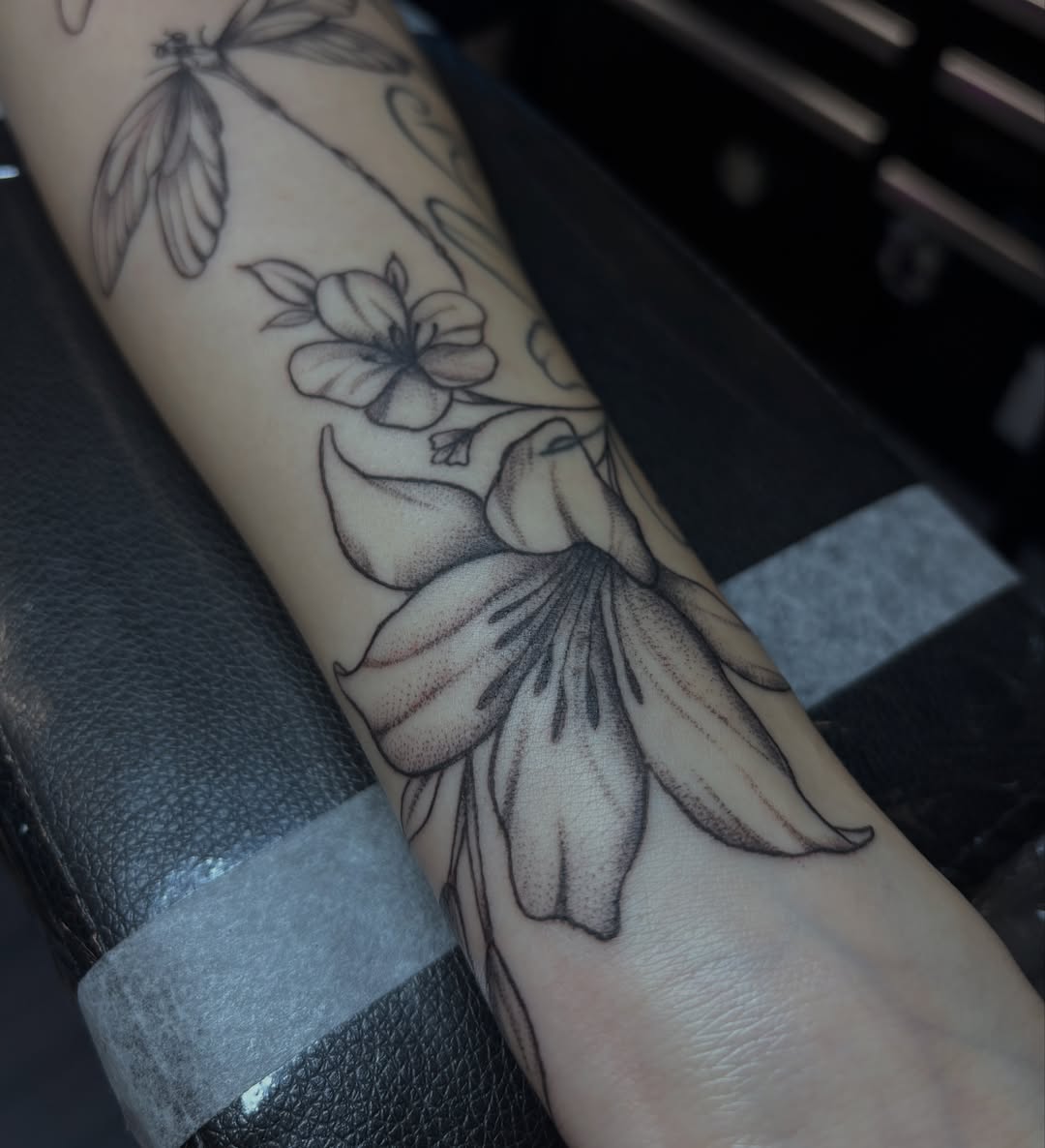 Flower dotwork tattoo on the forearm by Sydney Gallucci