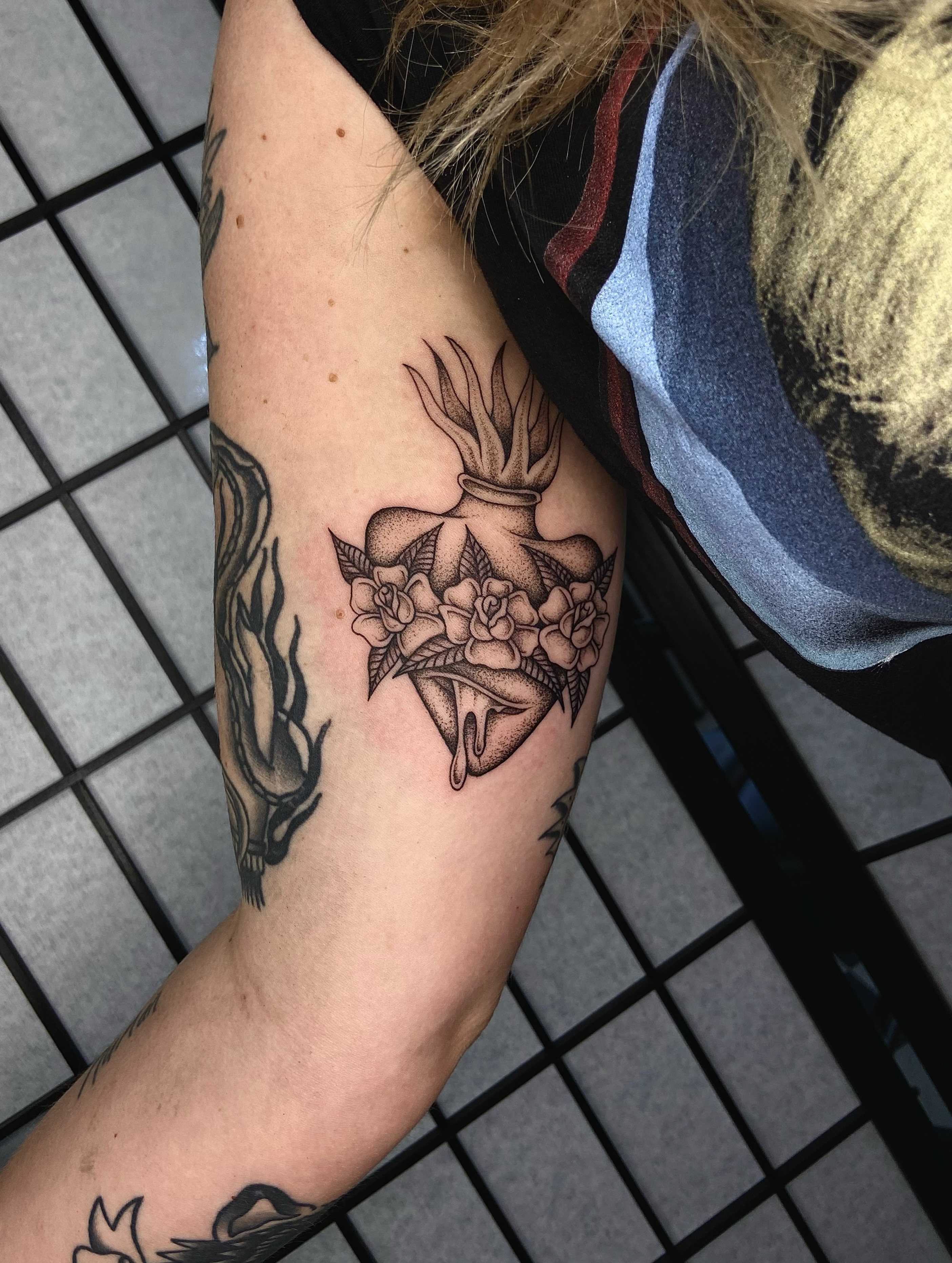 Heart with flowers dotwork tattoo on the forearm by R y a n S m i t h
